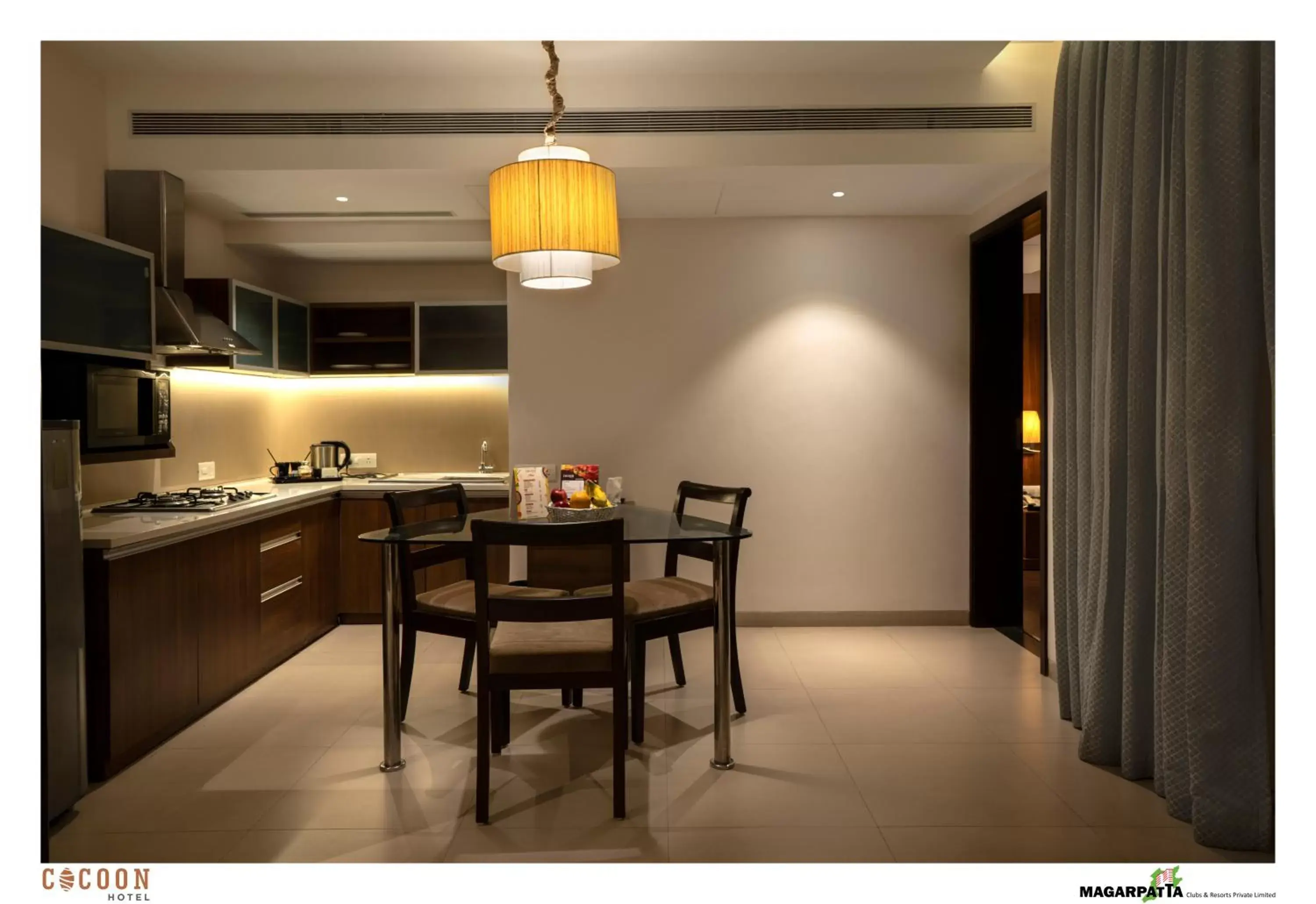 Kitchen or kitchenette, Dining Area in Cocoon Hotel