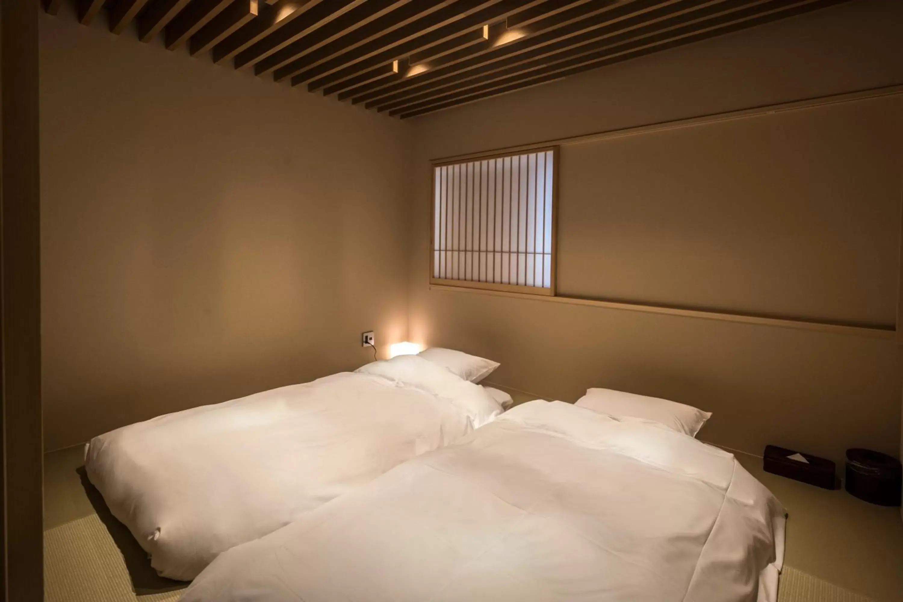 Bed in Tomoya Residence Hotel Kyoto