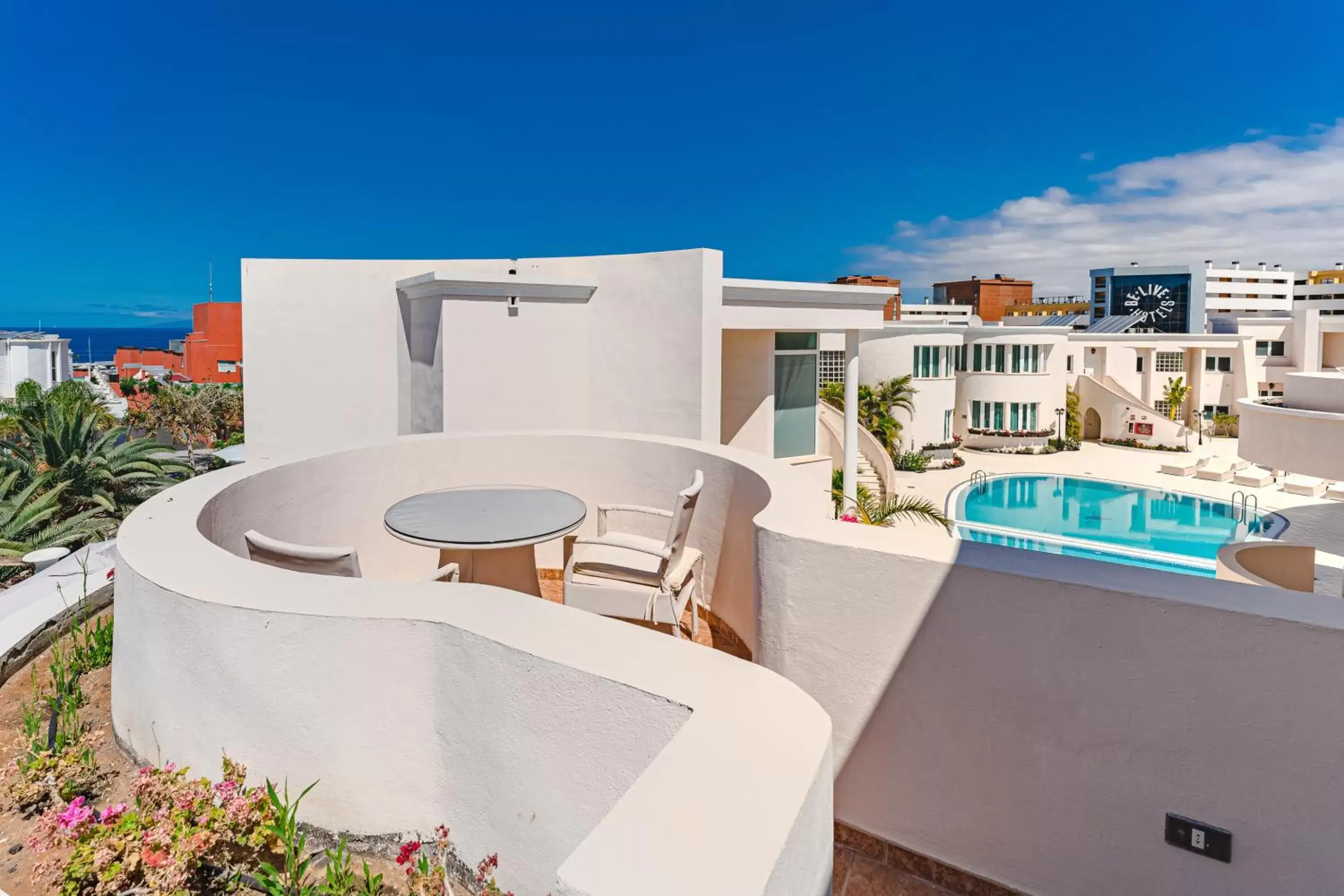 Balcony/Terrace, Pool View in Flamingo Suites Boutique Hotel