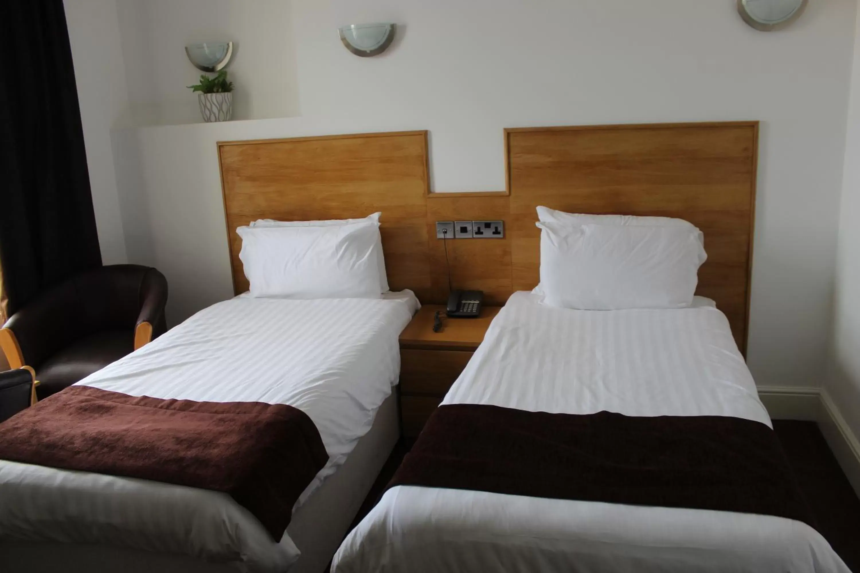 Bed in Four Saints Brig Y Don Hotel