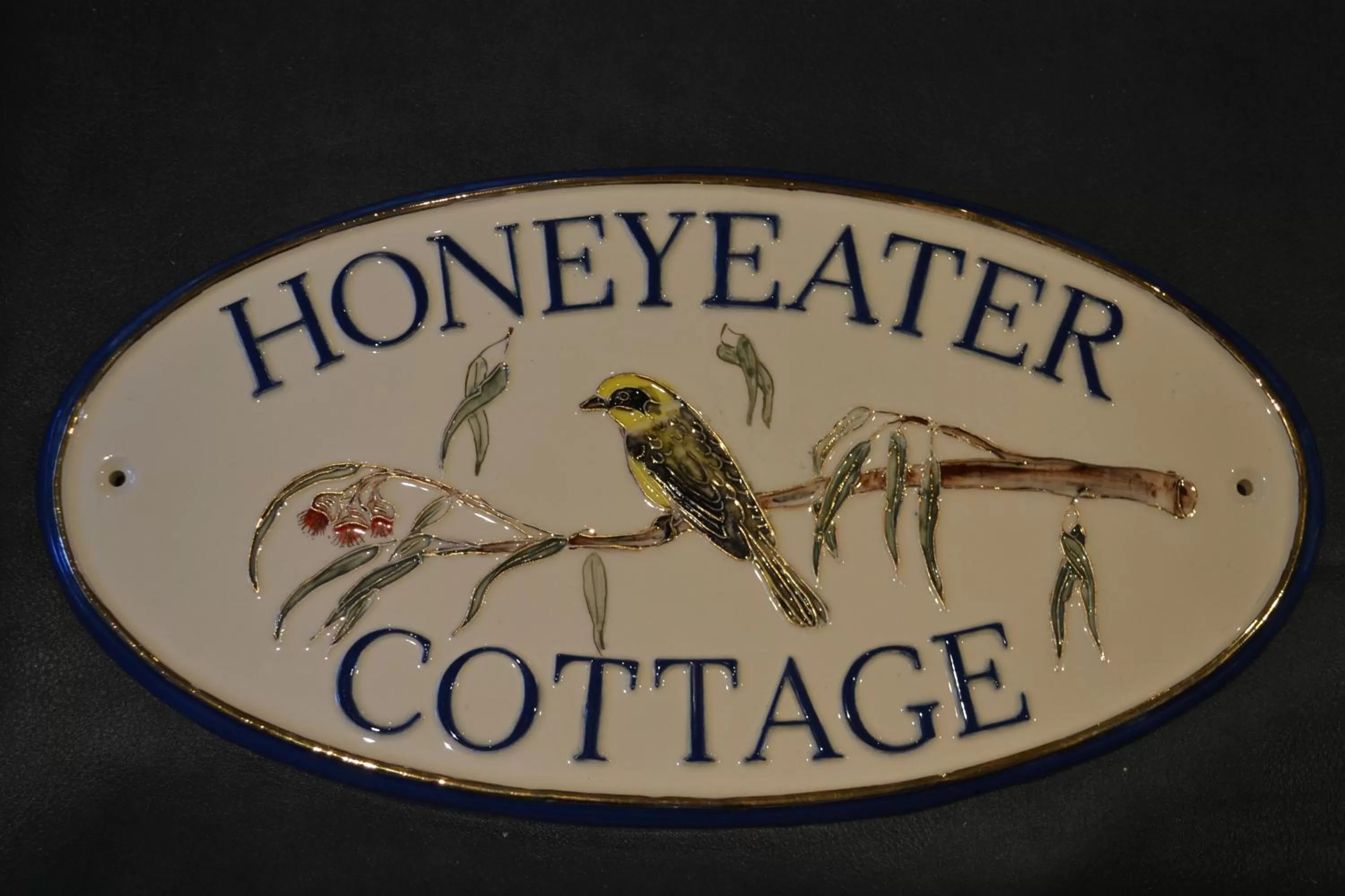 Property Logo/Sign in Honeyeater Cottage