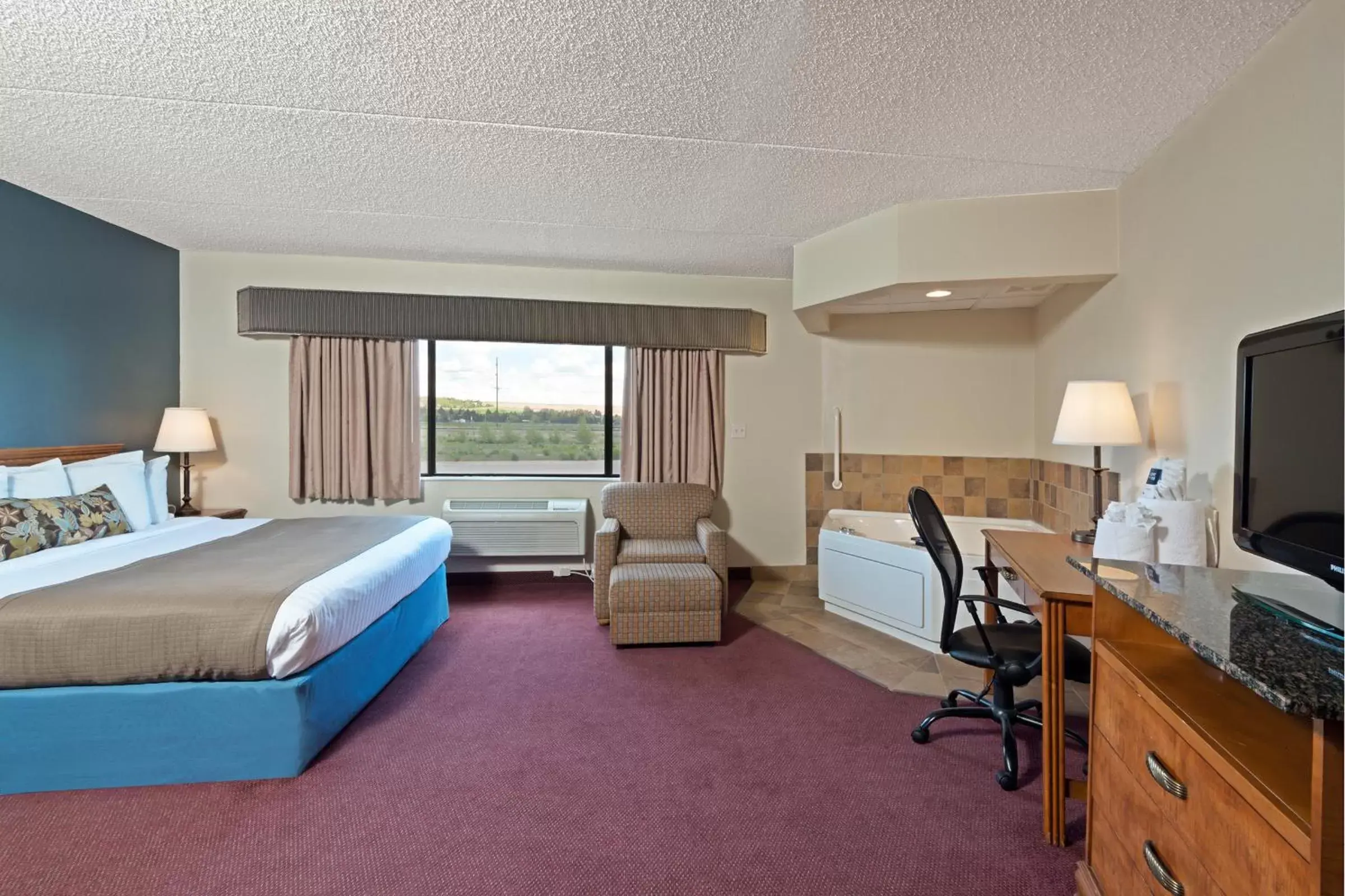 Photo of the whole room in AmericInn by Wyndham Rexburg BYUI