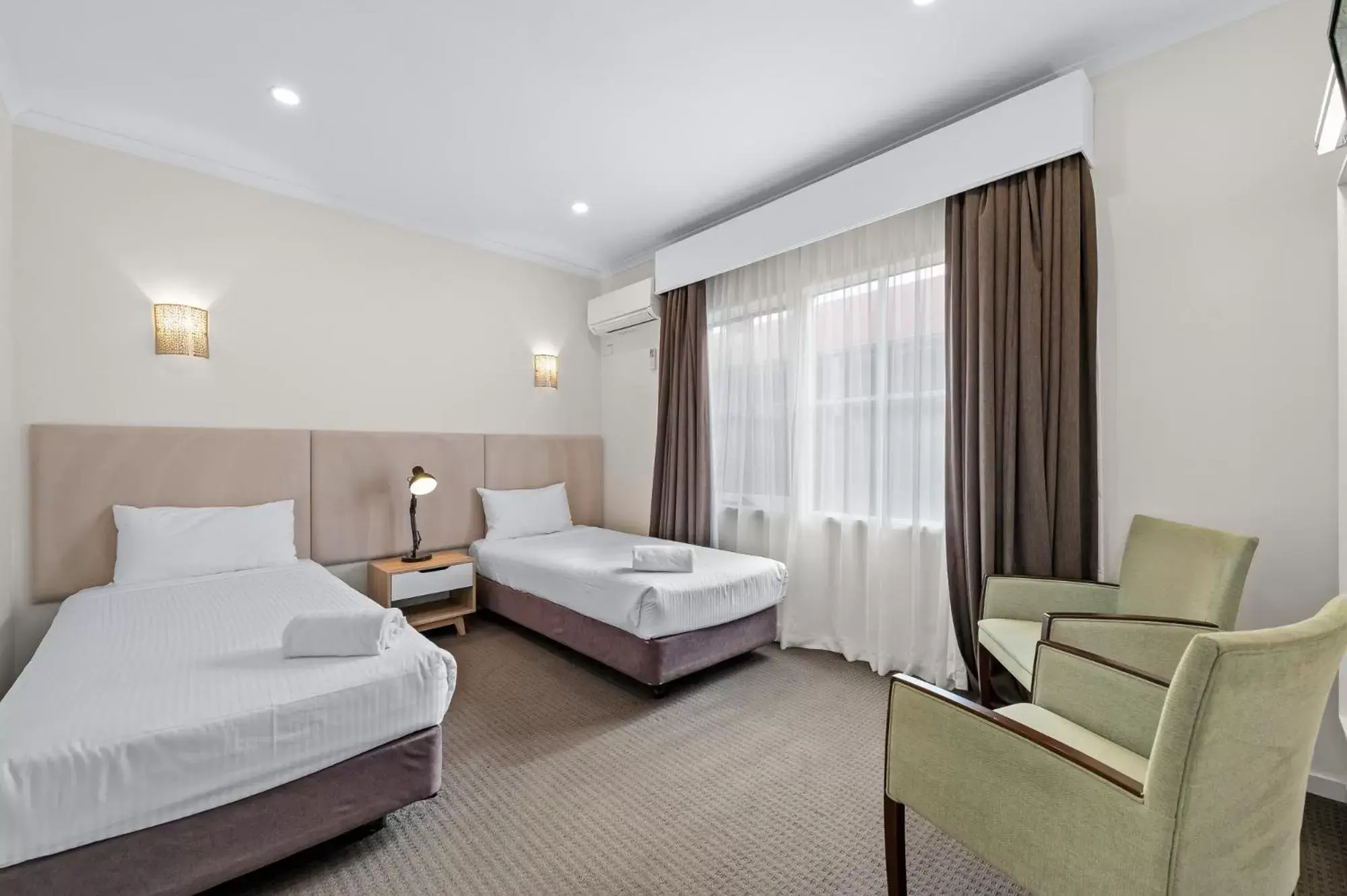 Bed in Rowville International Hotel