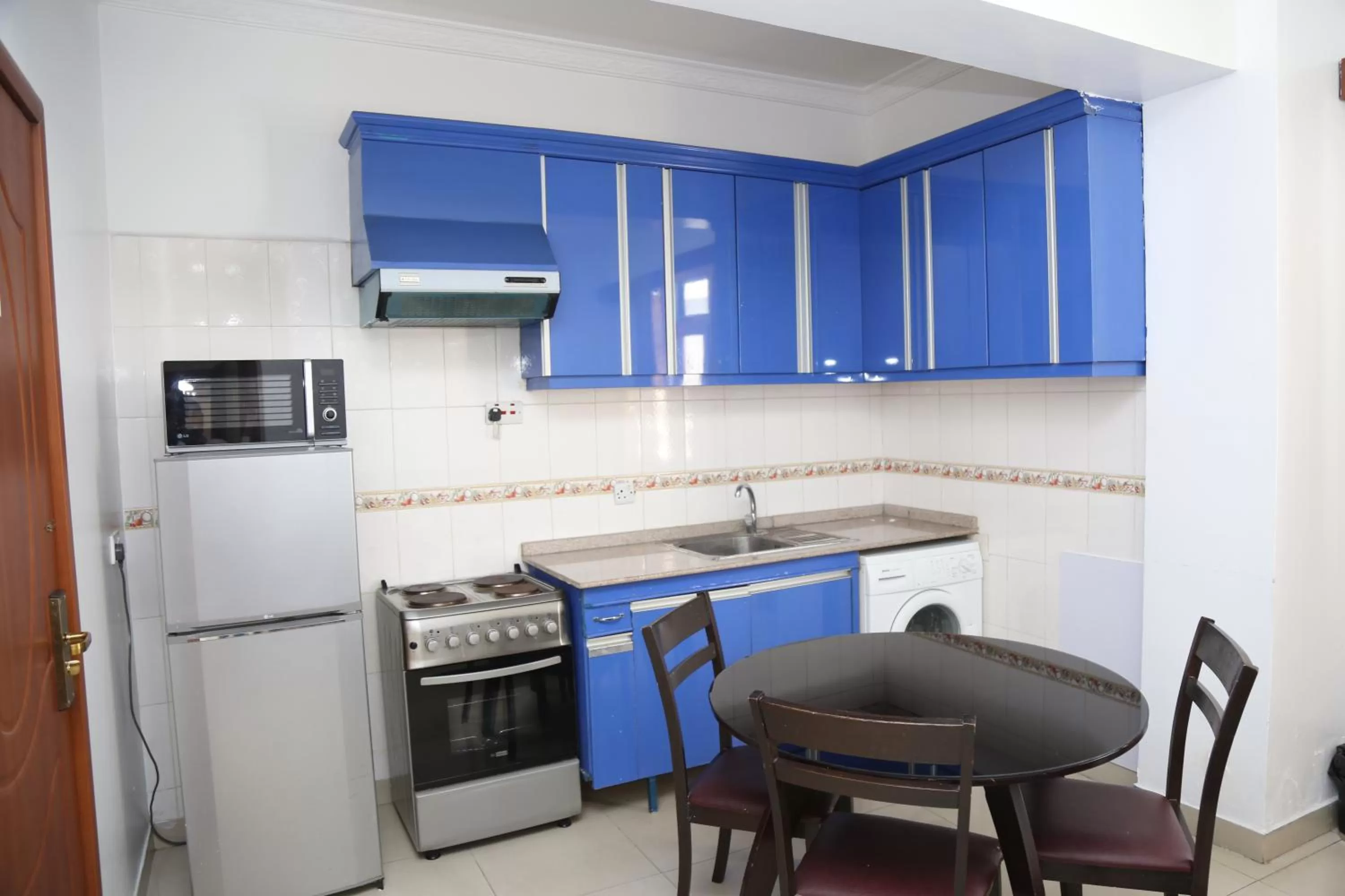 Kitchen or kitchenette in Rainbow Hotel