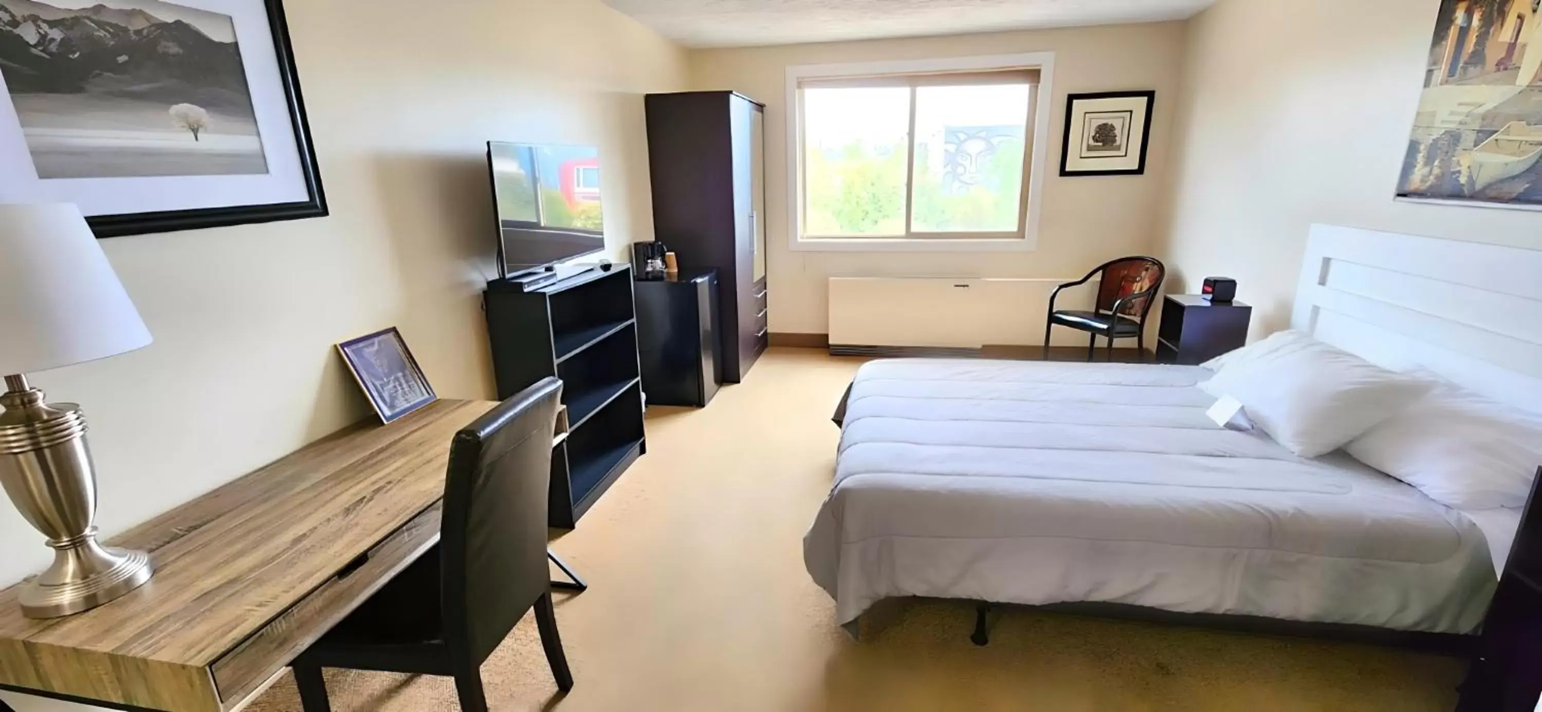 Photo of the whole room, TV/Entertainment Center in The Medicine Hat Villa