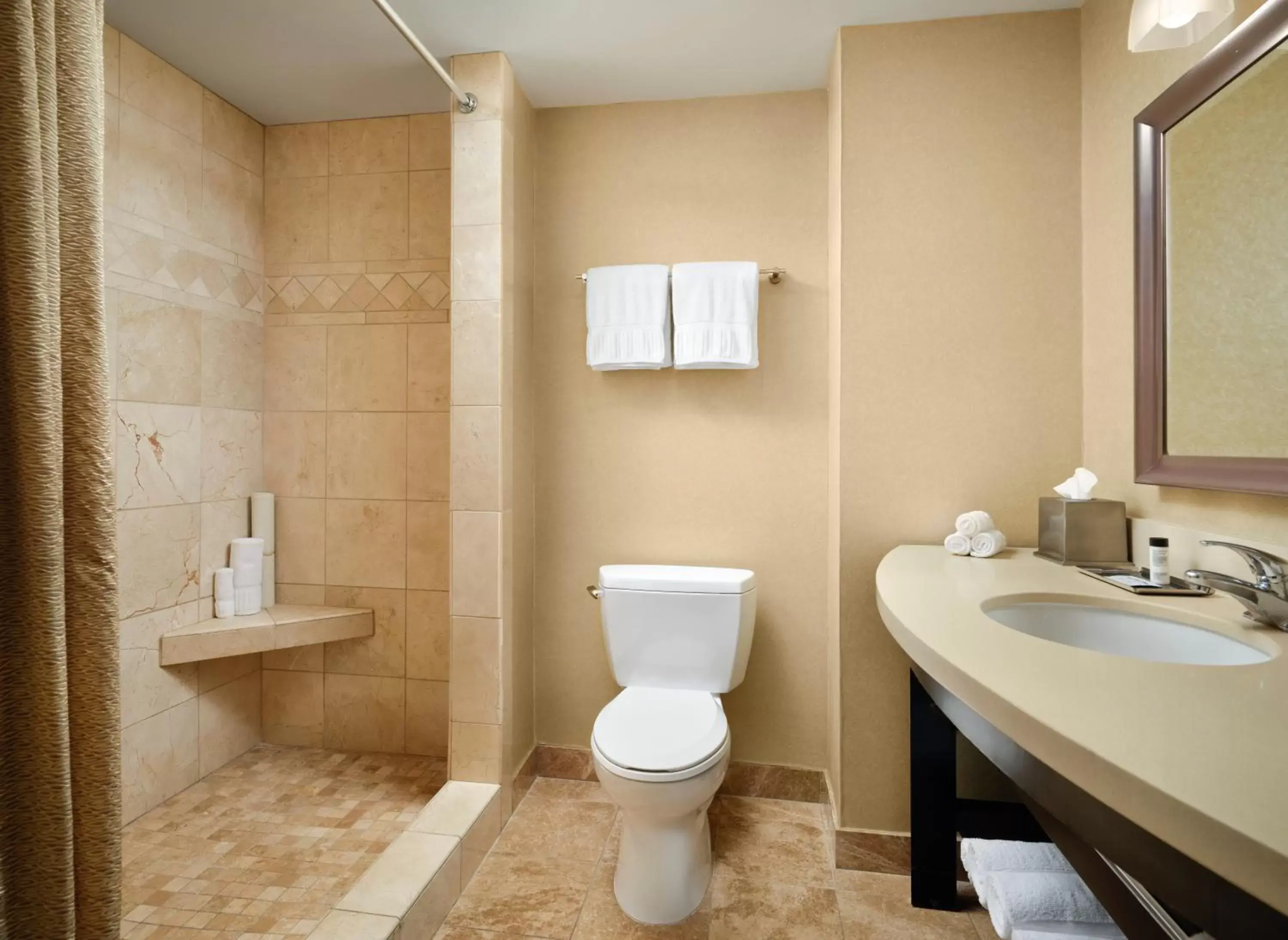 Bathroom in West Inn & Suites Bathroom in West Inn & Suites