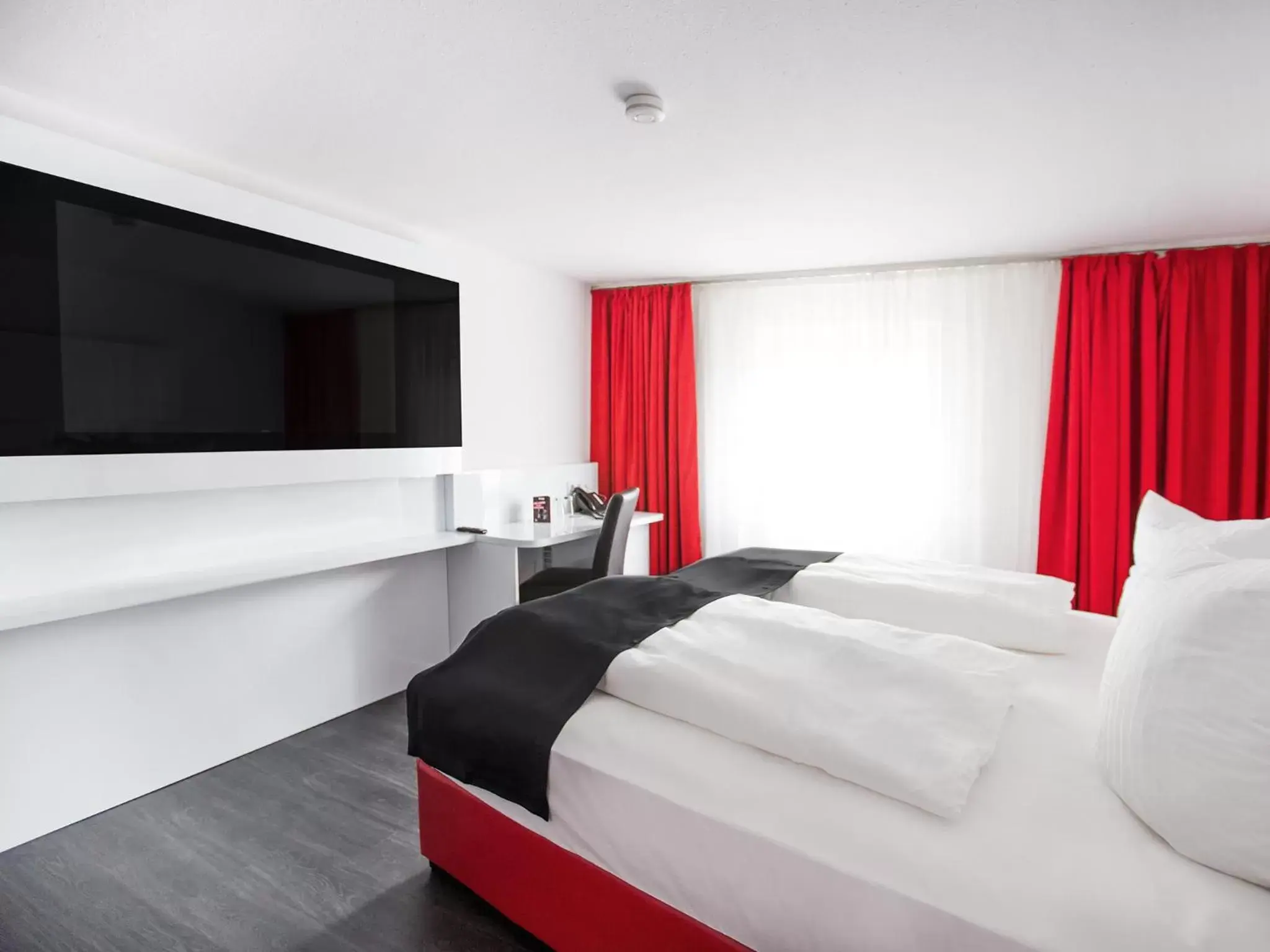 Photo of the whole room, Bed in DORMERO Hotel Villingen-Schwenningen