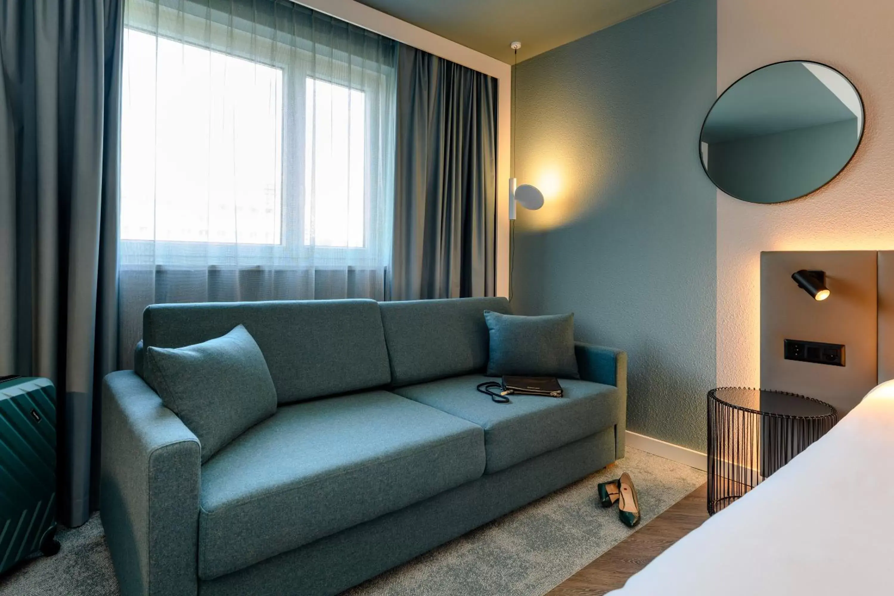 Bed, Seating Area in Novotel Zurich City West