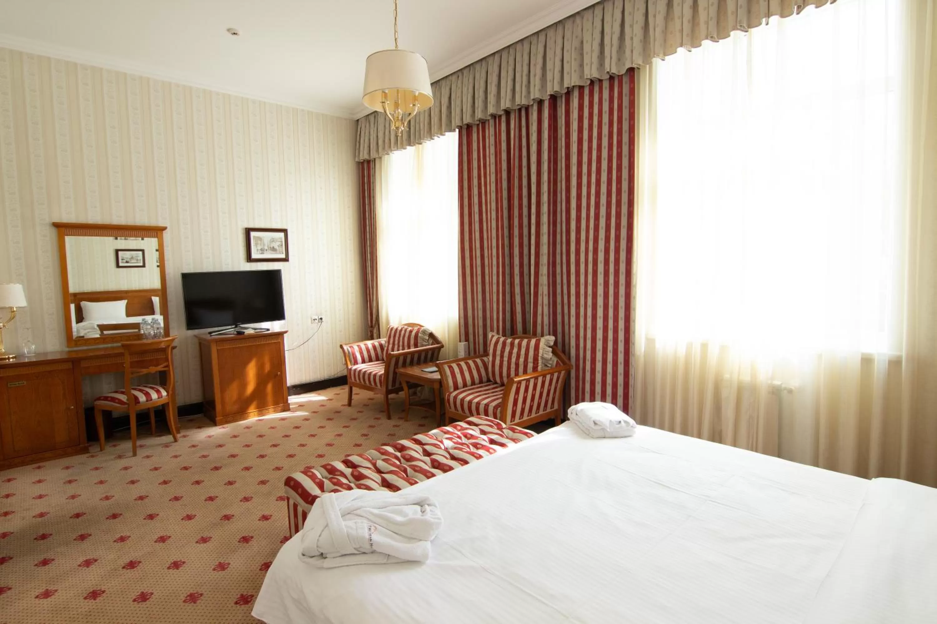 Bed in Grand Tien Shan Hotel