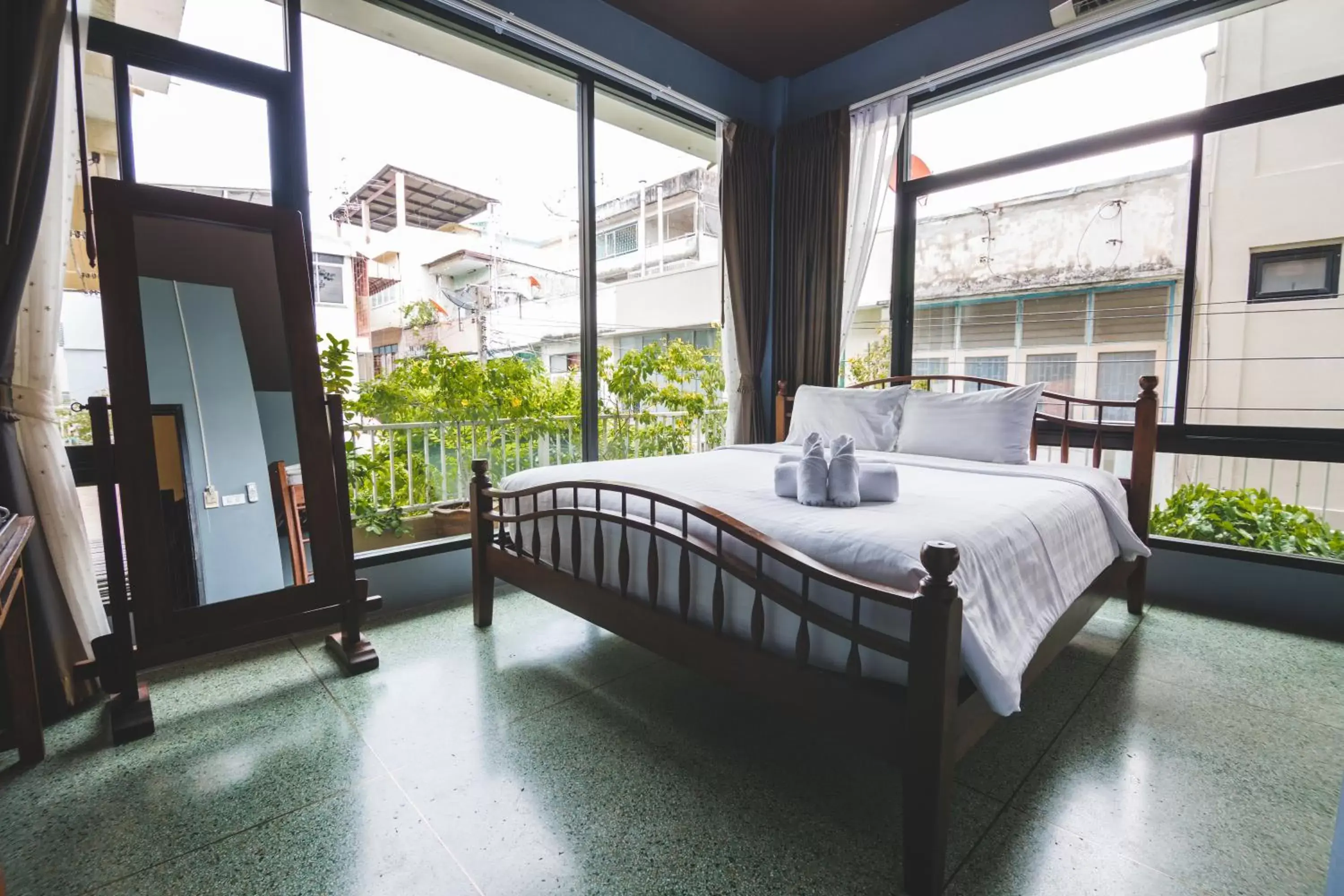 Bedroom in Feung Nakorn Balcony Rooms and Cafe