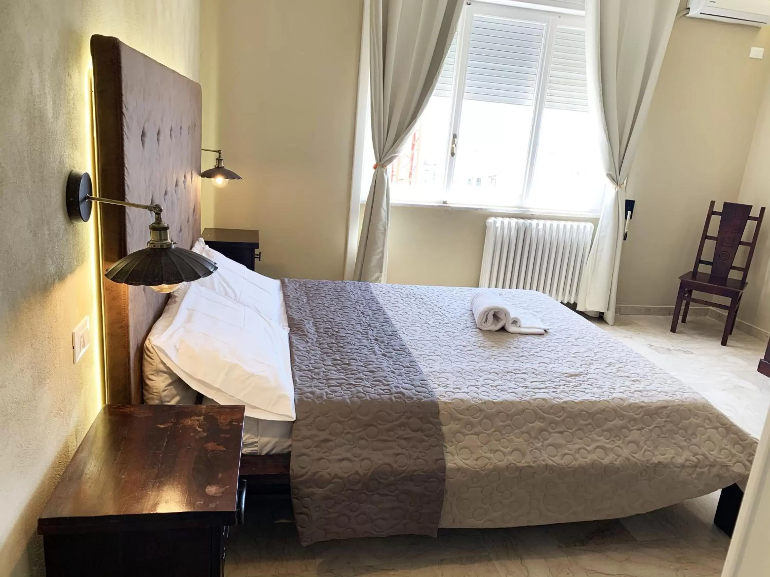 Bedroom, Bed in L'Attico di Piazza Mazzini Rooms