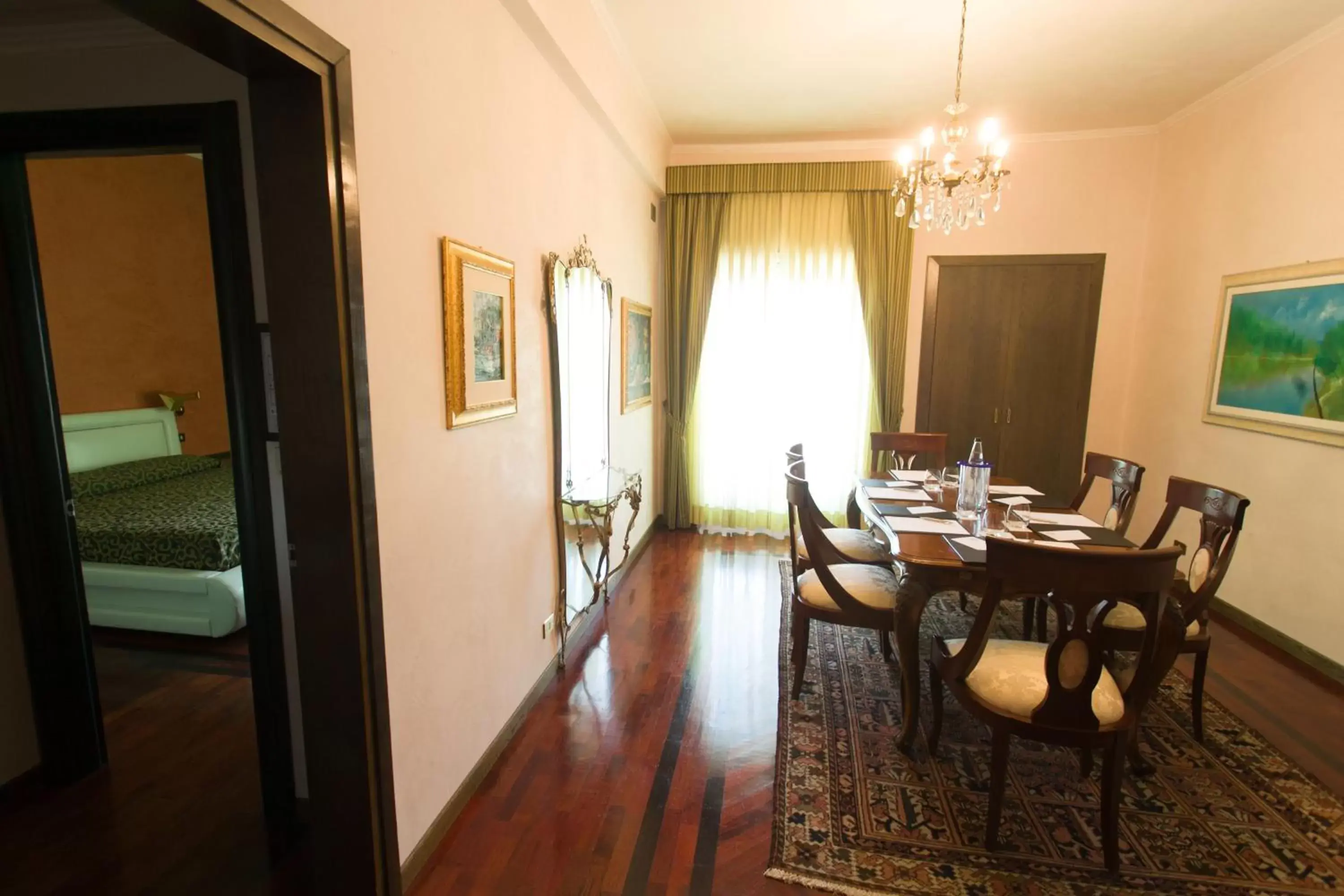 Bed, Dining Area in Astor Hotel Vintage