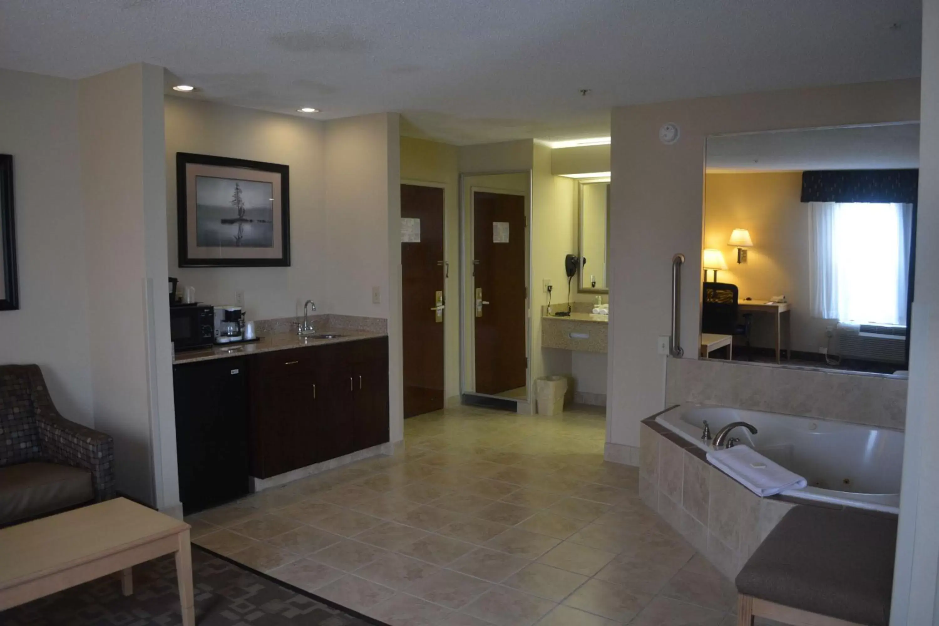 Photo of the whole room, Kitchen/Kitchenette in SureStay Plus Hotel by Best Western Roanoke Rapids I-95