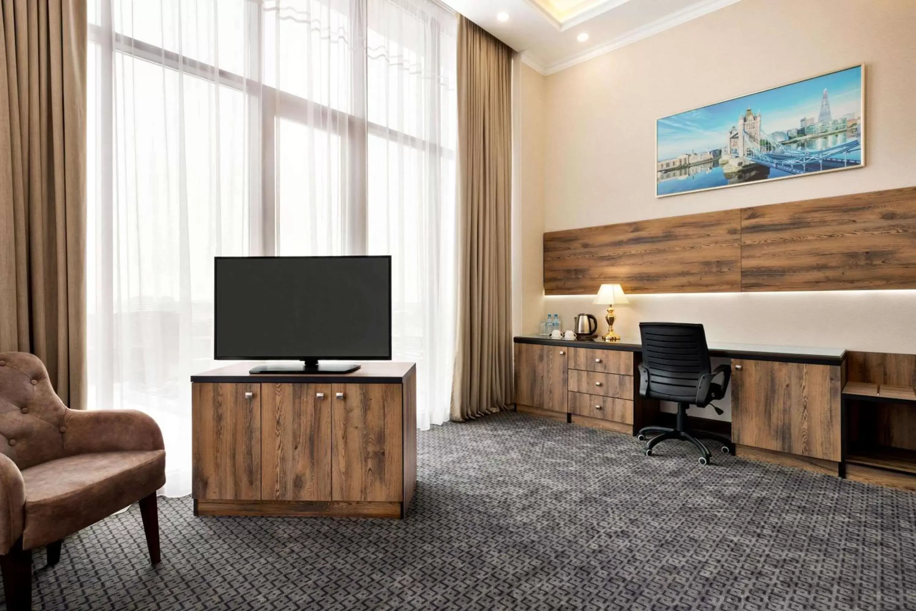Photo of the whole room, TV/Entertainment Center in Ramada by Wyndham Shymkent