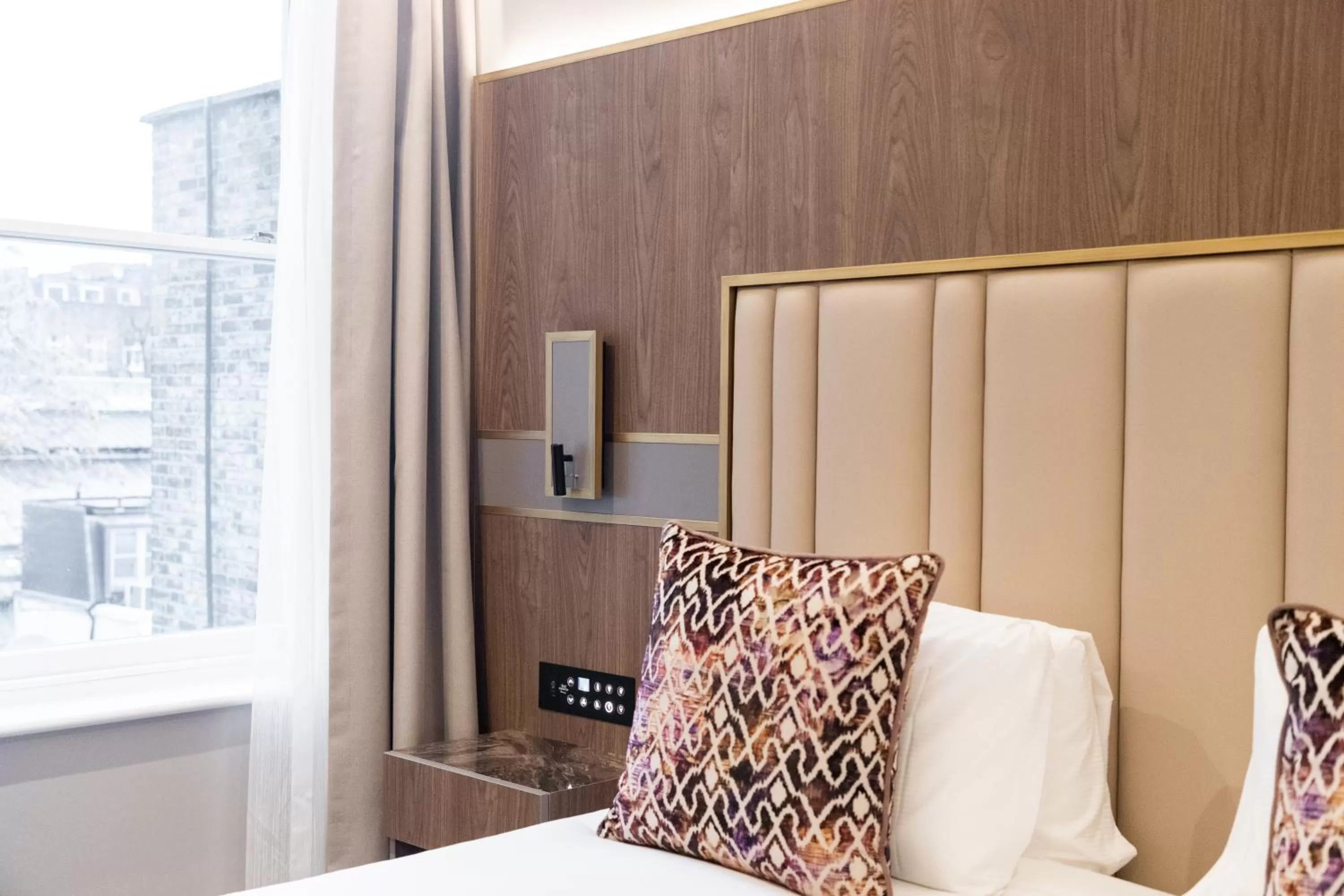 Bed in Merit Kensington Hotel