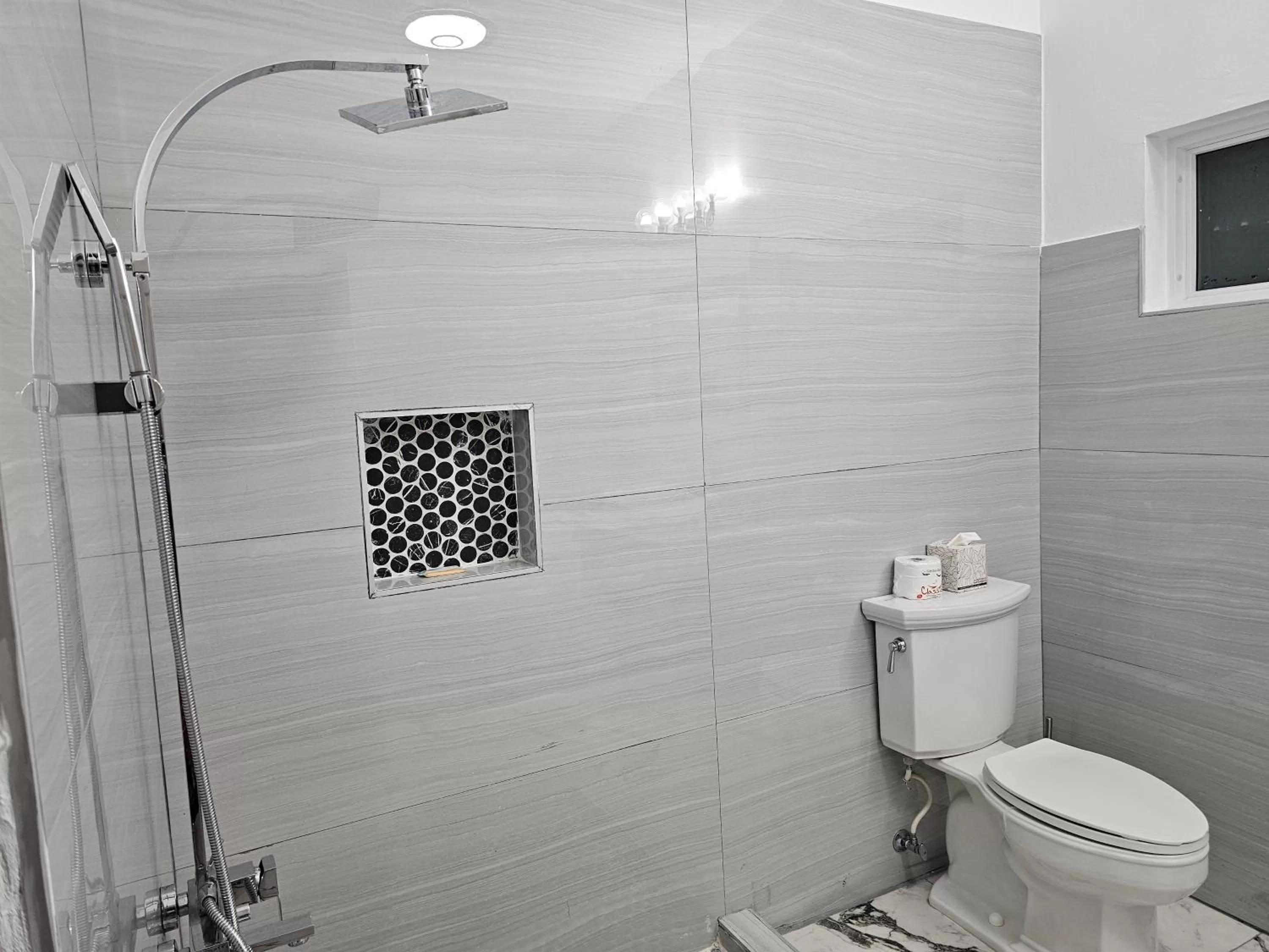 Shower in Roots Cafe Rooms