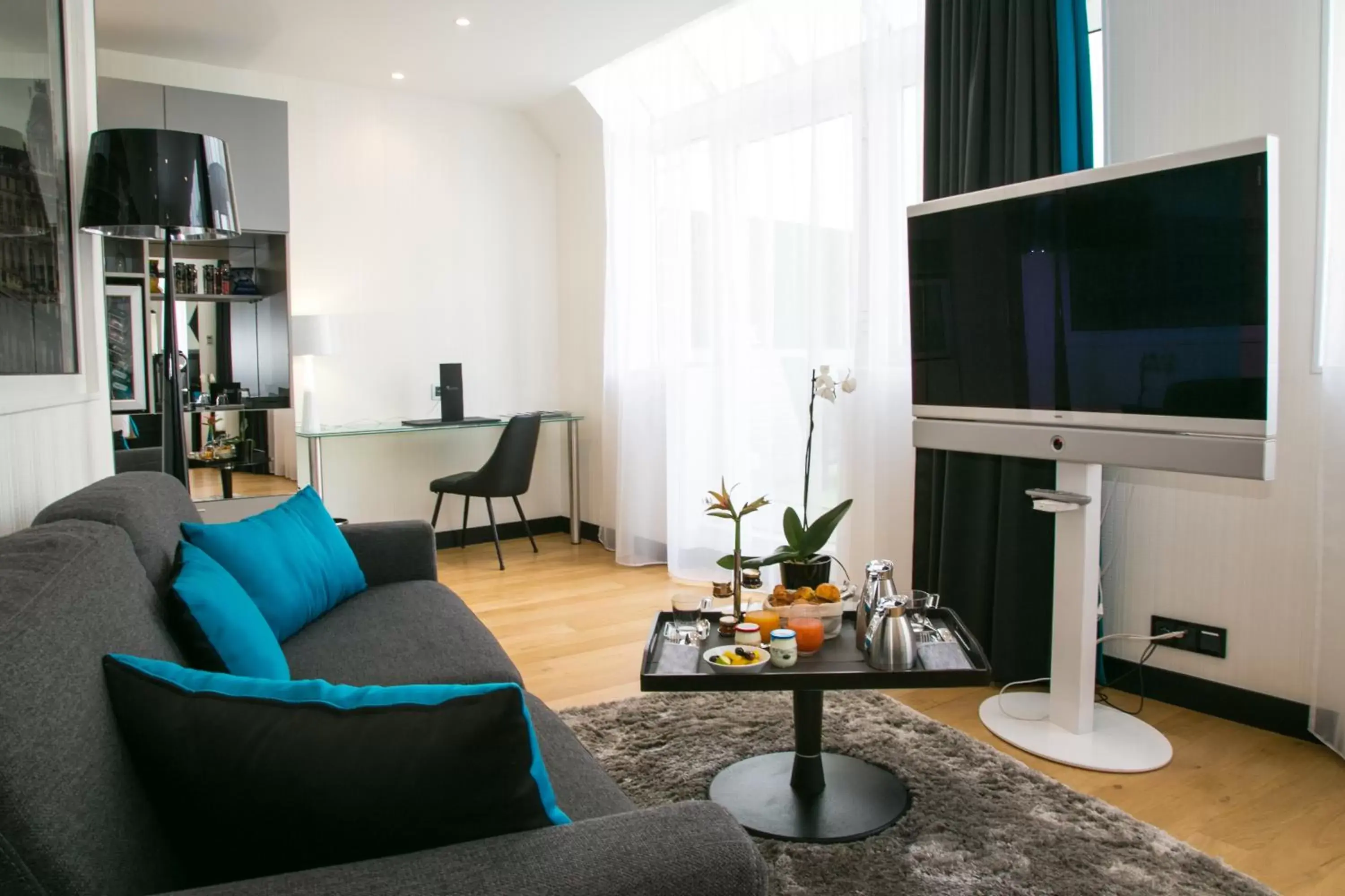 Living room, TV/Entertainment Center in L'Empire Paris