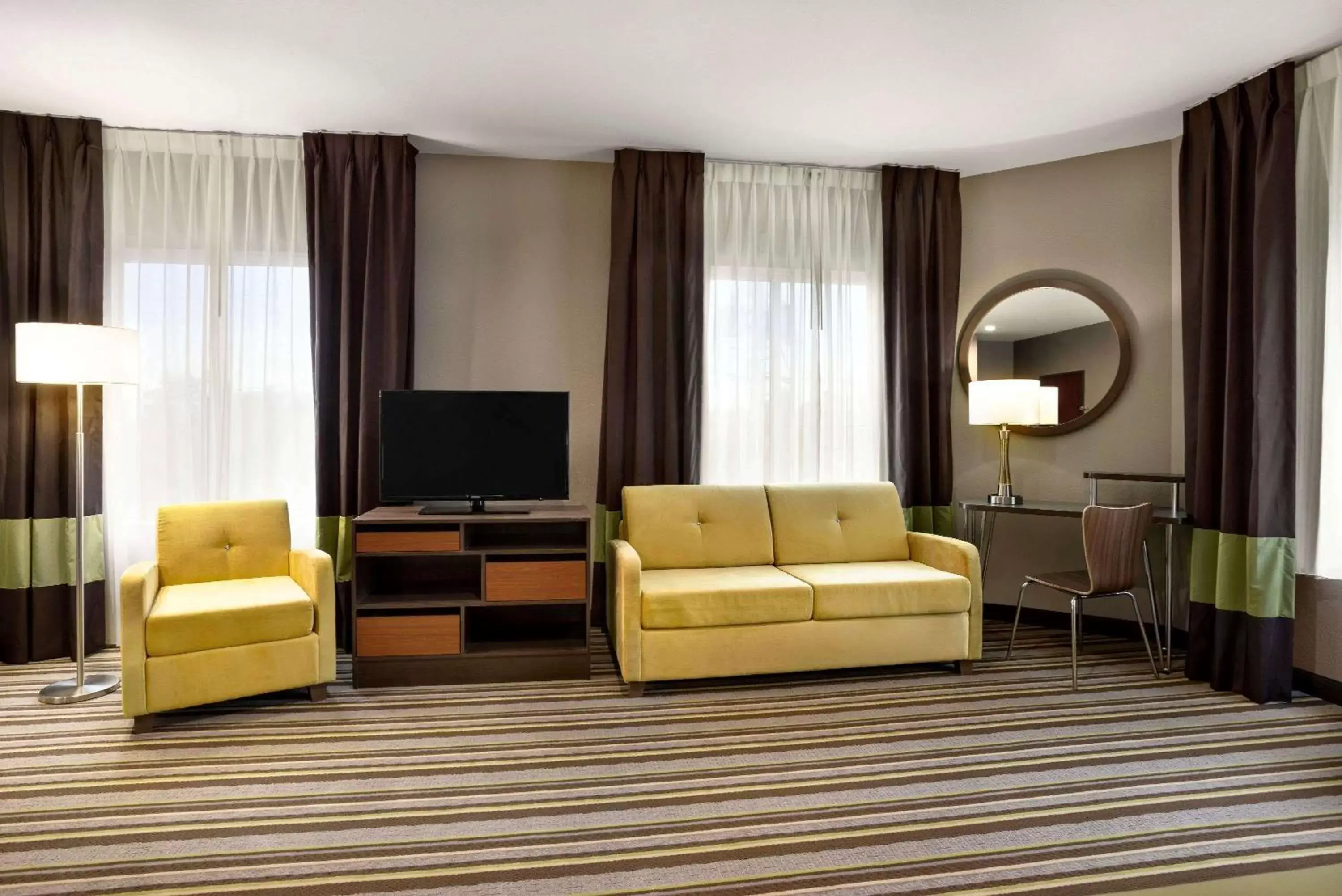 Photo of the whole room, Seating Area in Super 8 by Wyndham Hershey