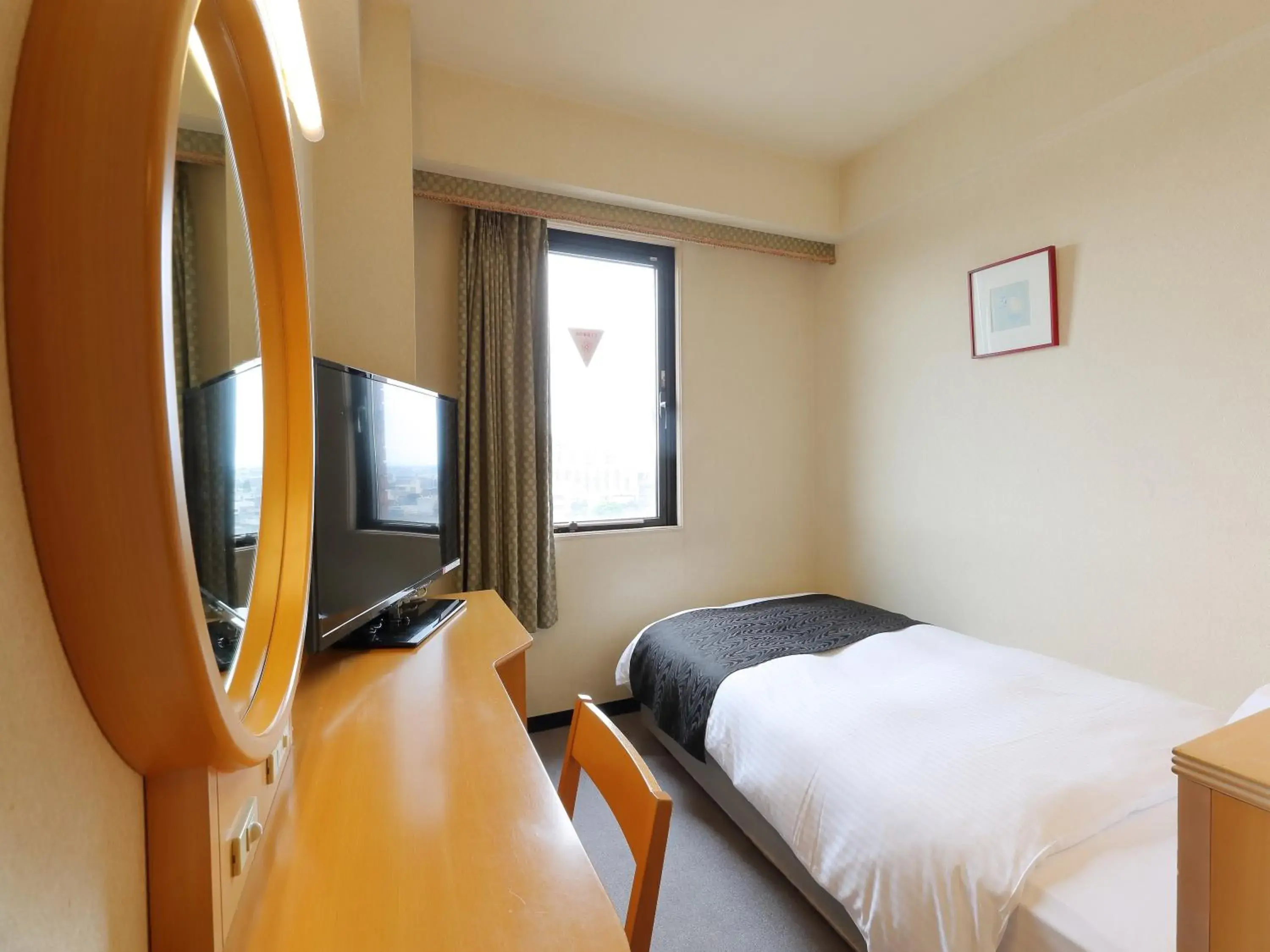 Photo of the whole room, Bed in Apa Hotel Tonami-Ekimae