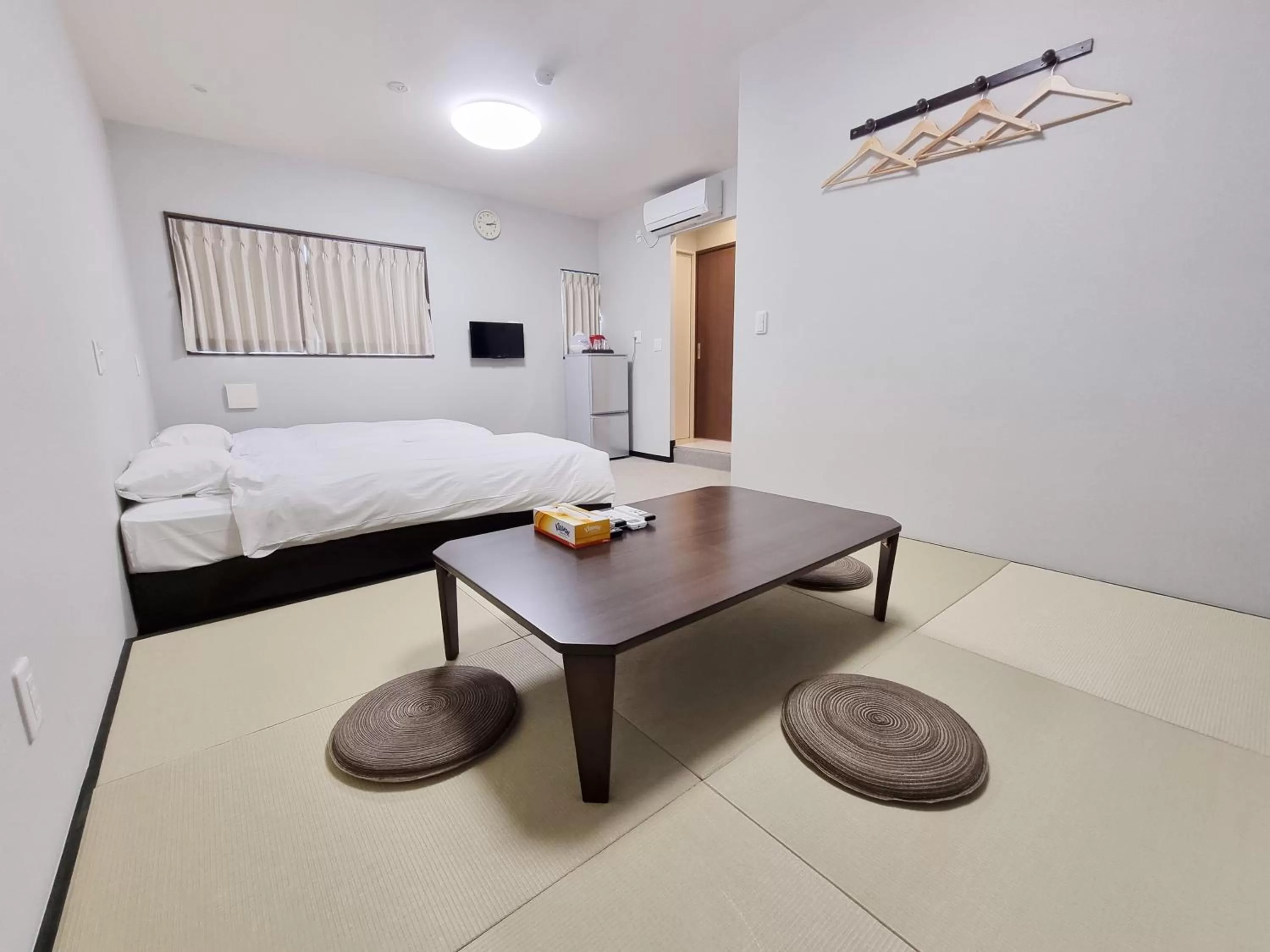 Bed in KYU KYU HOTEL