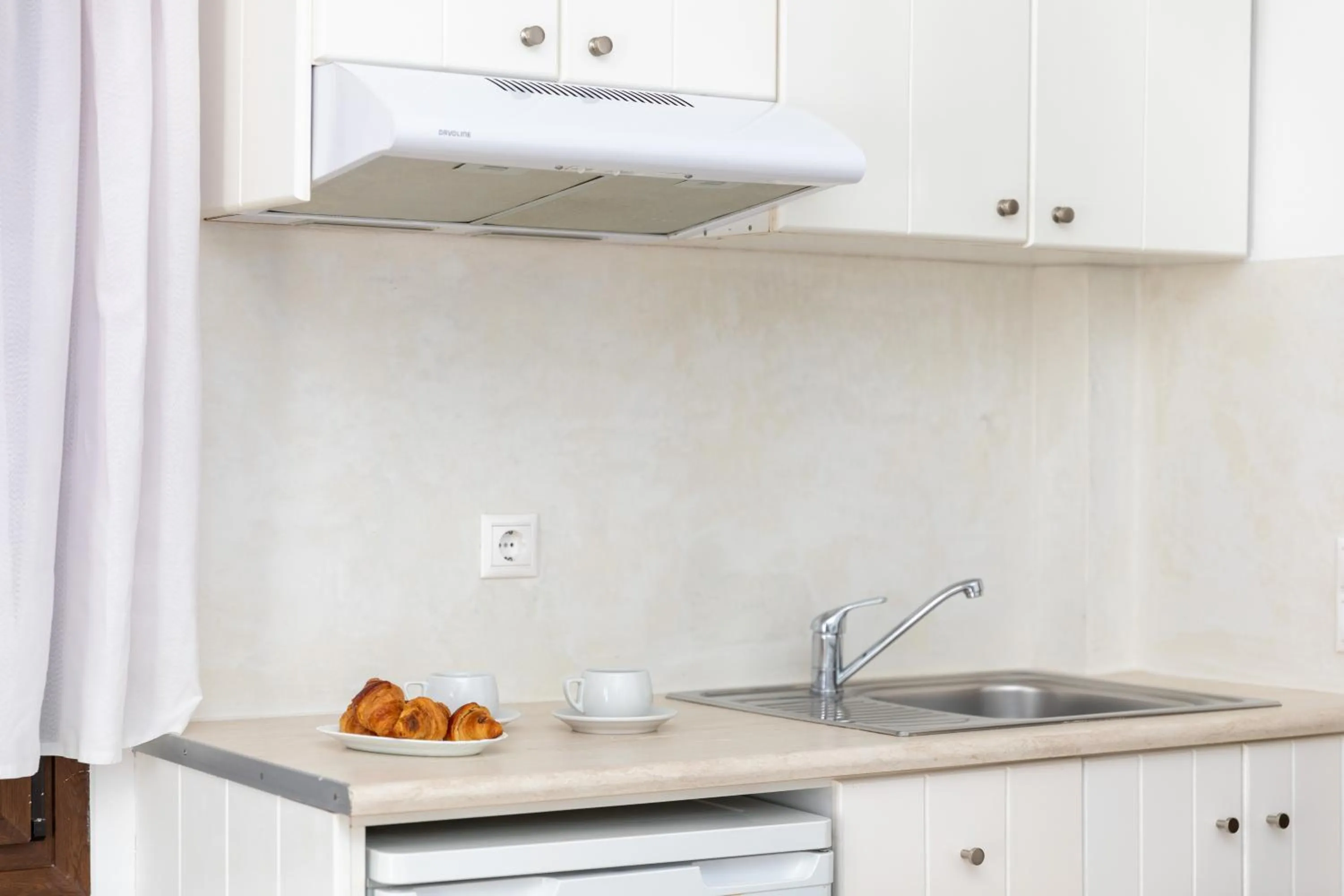 Coffee/tea facilities, Kitchen/Kitchenette in Depis Place and Apartments