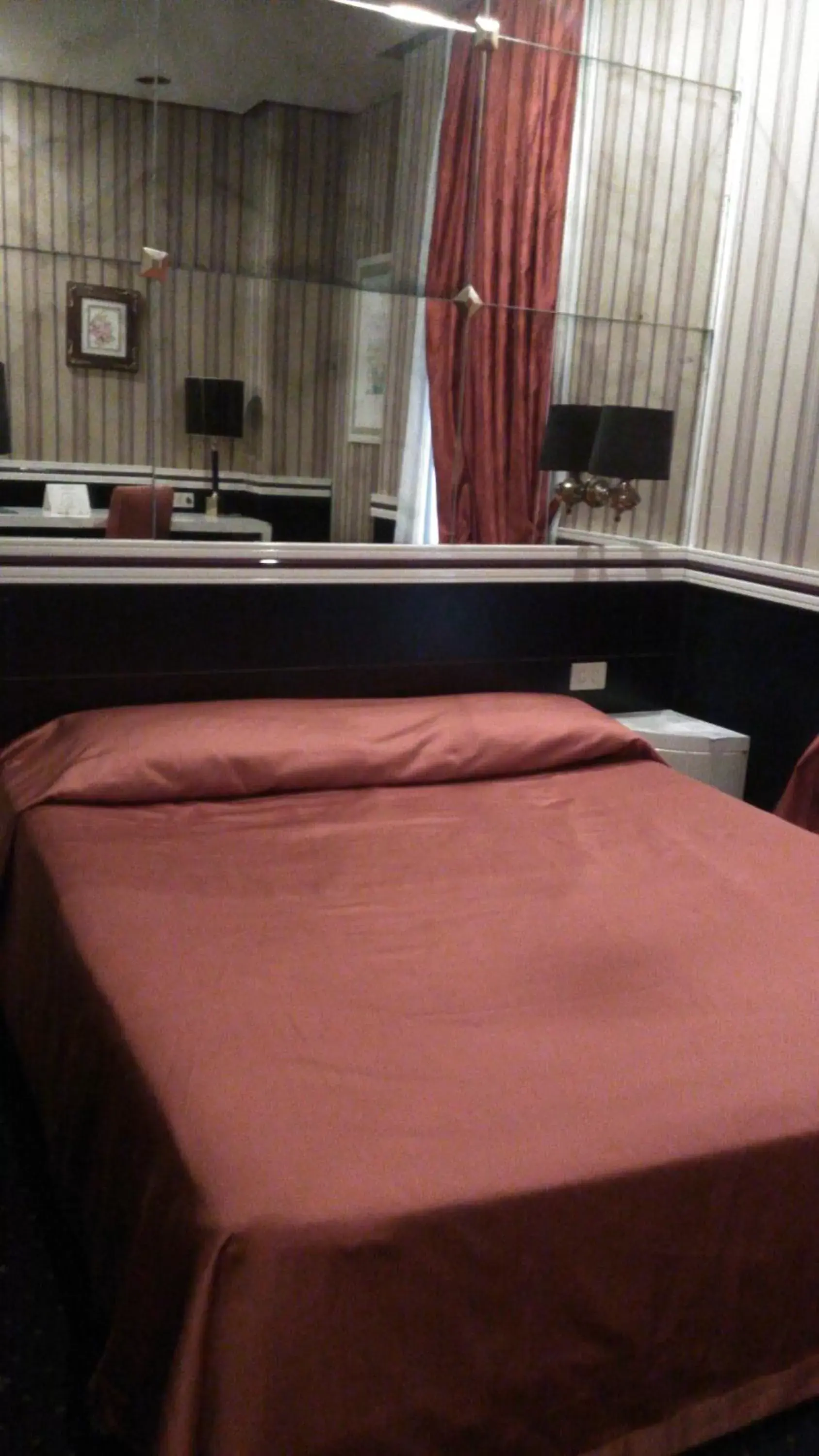 Bed in Atlante Star Hotel