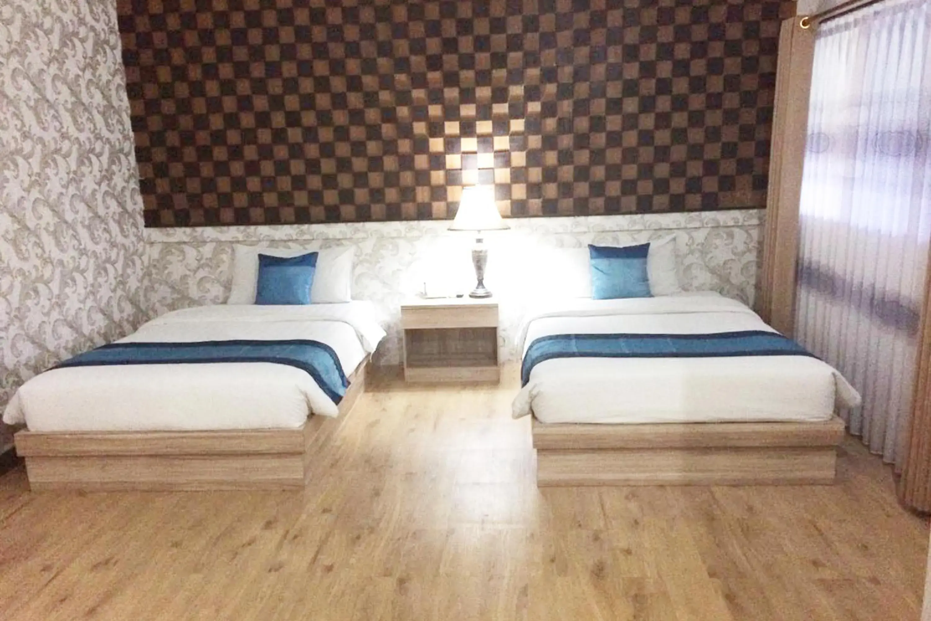 Bed in Puri Saron Denpasar Hotel