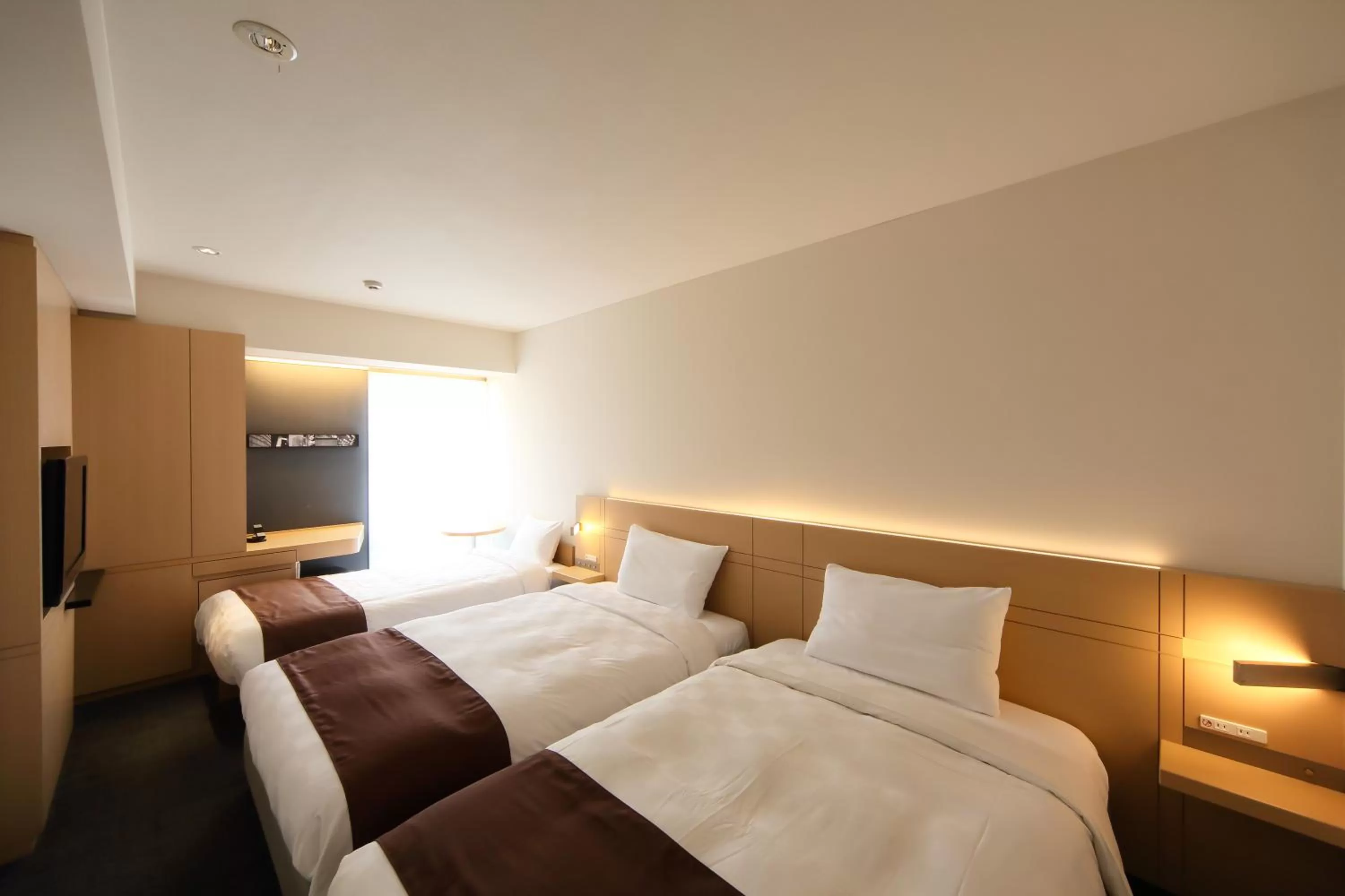 Bed in Hakata Tokyu REI Hotel