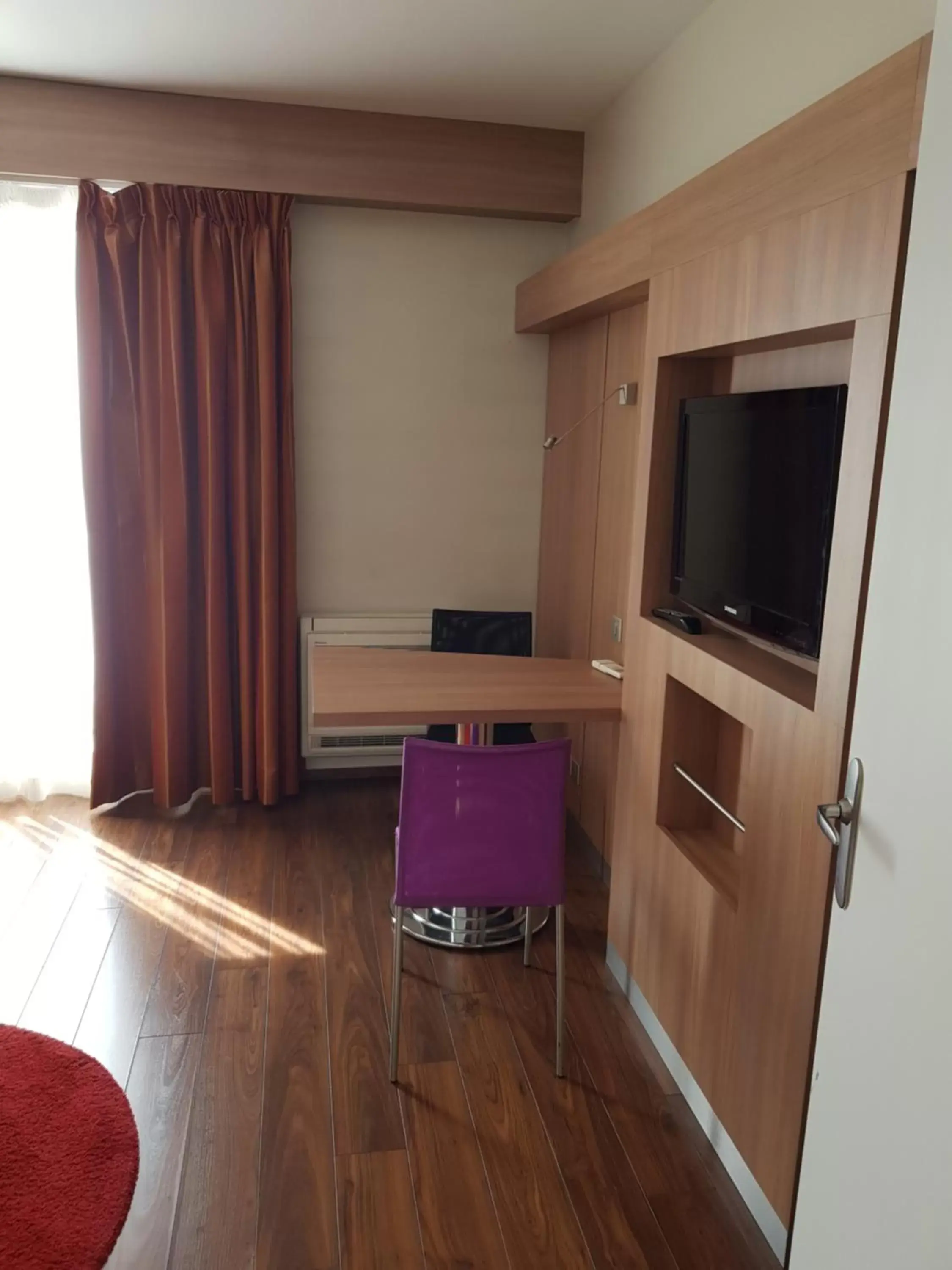 TV and multimedia, TV/Entertainment Center in Kyriad Hotel Tours Centre