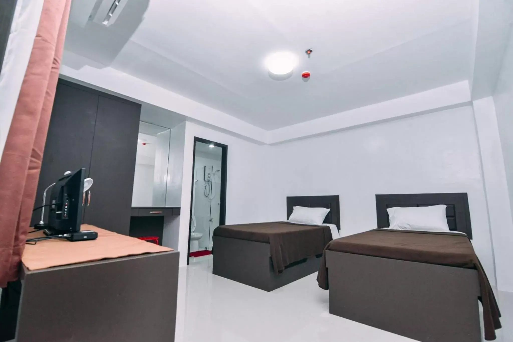 Photo of the whole room, Bed in The Strand Suites and Dormitel Photo of the whole room, Bed in The Strand Suites and Dormitel