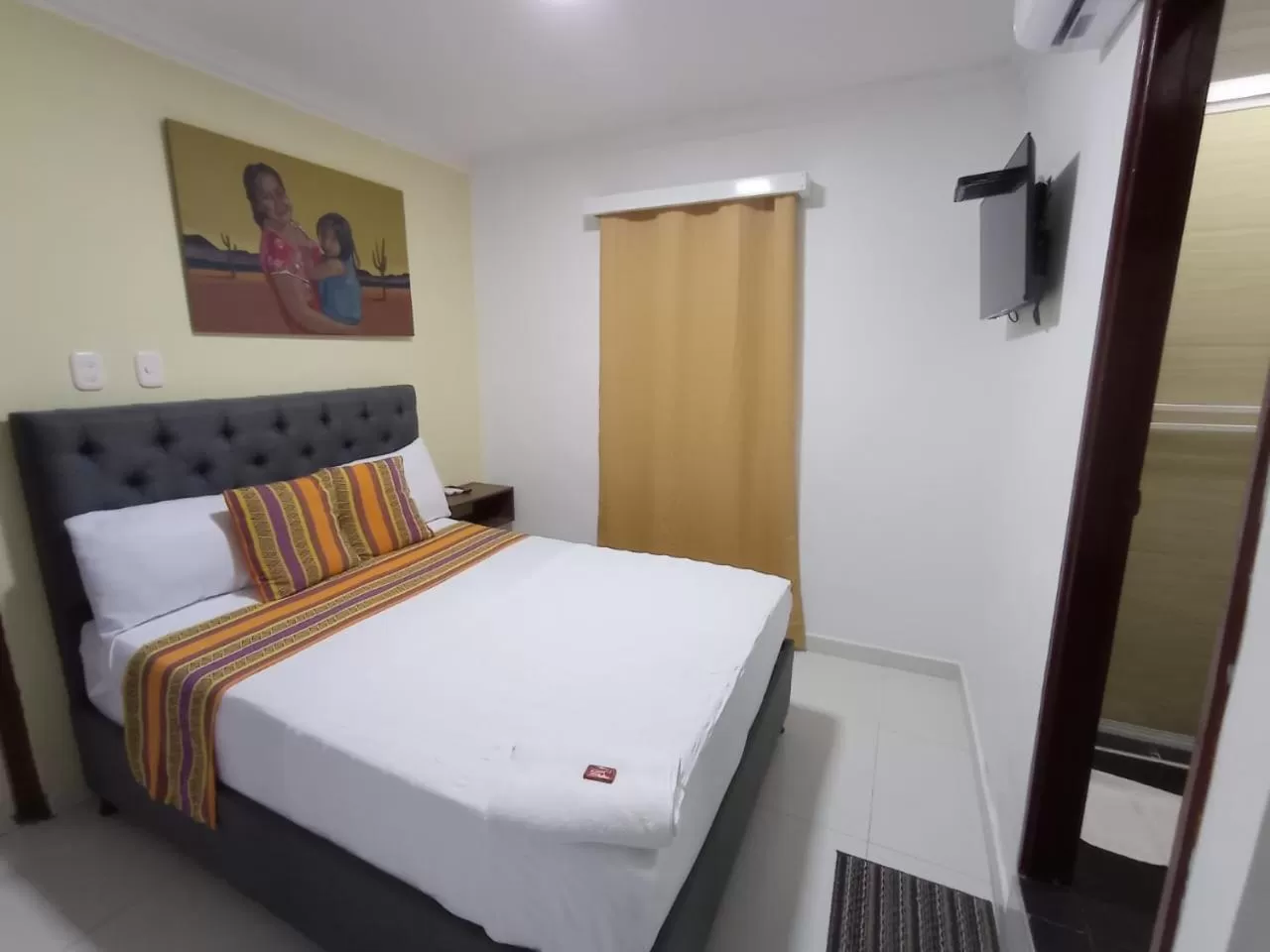 Bed in ANAJIRAWAA HOTEL