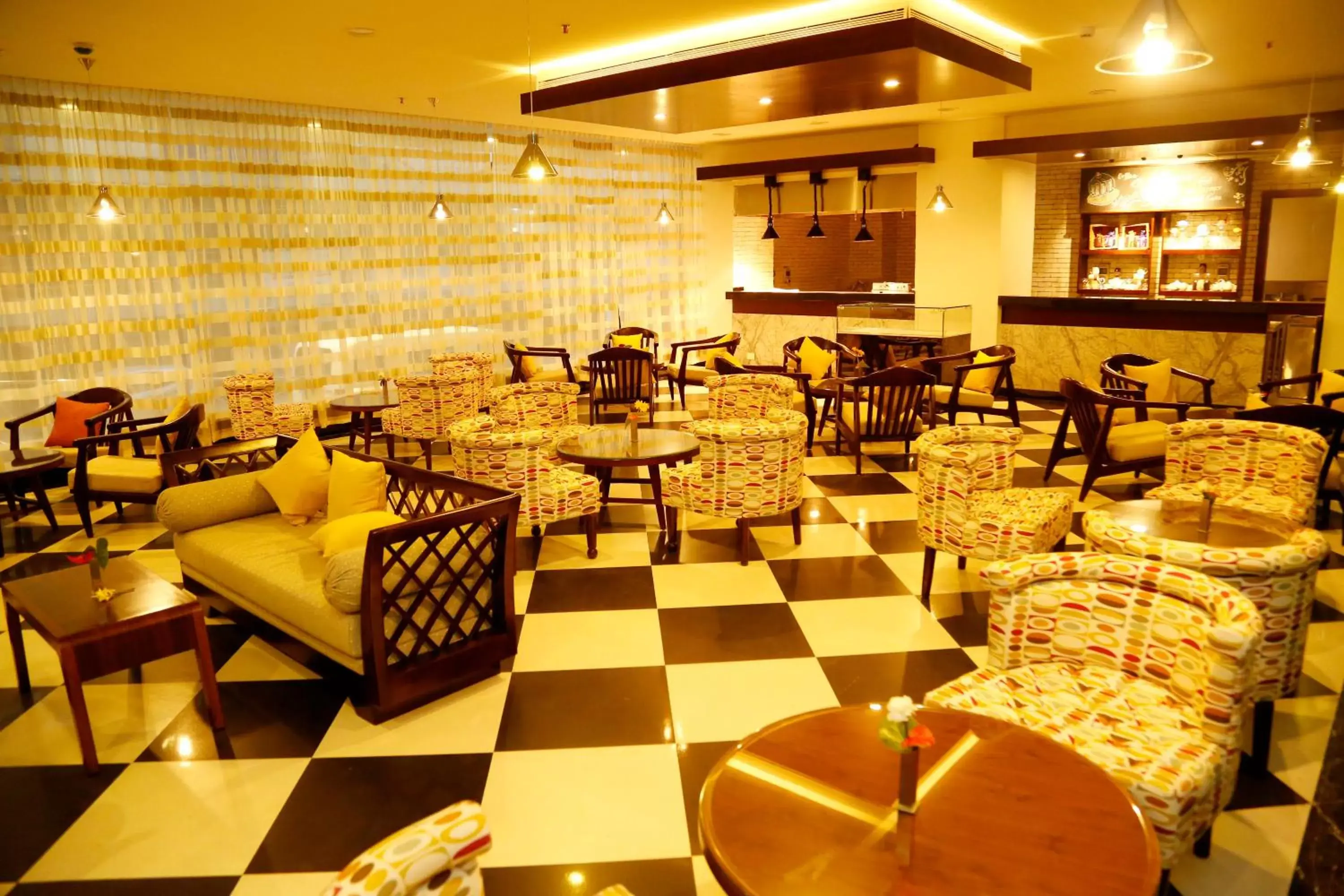 Communal lounge/ TV room, Restaurant/Places to Eat in The Raviz Calicut