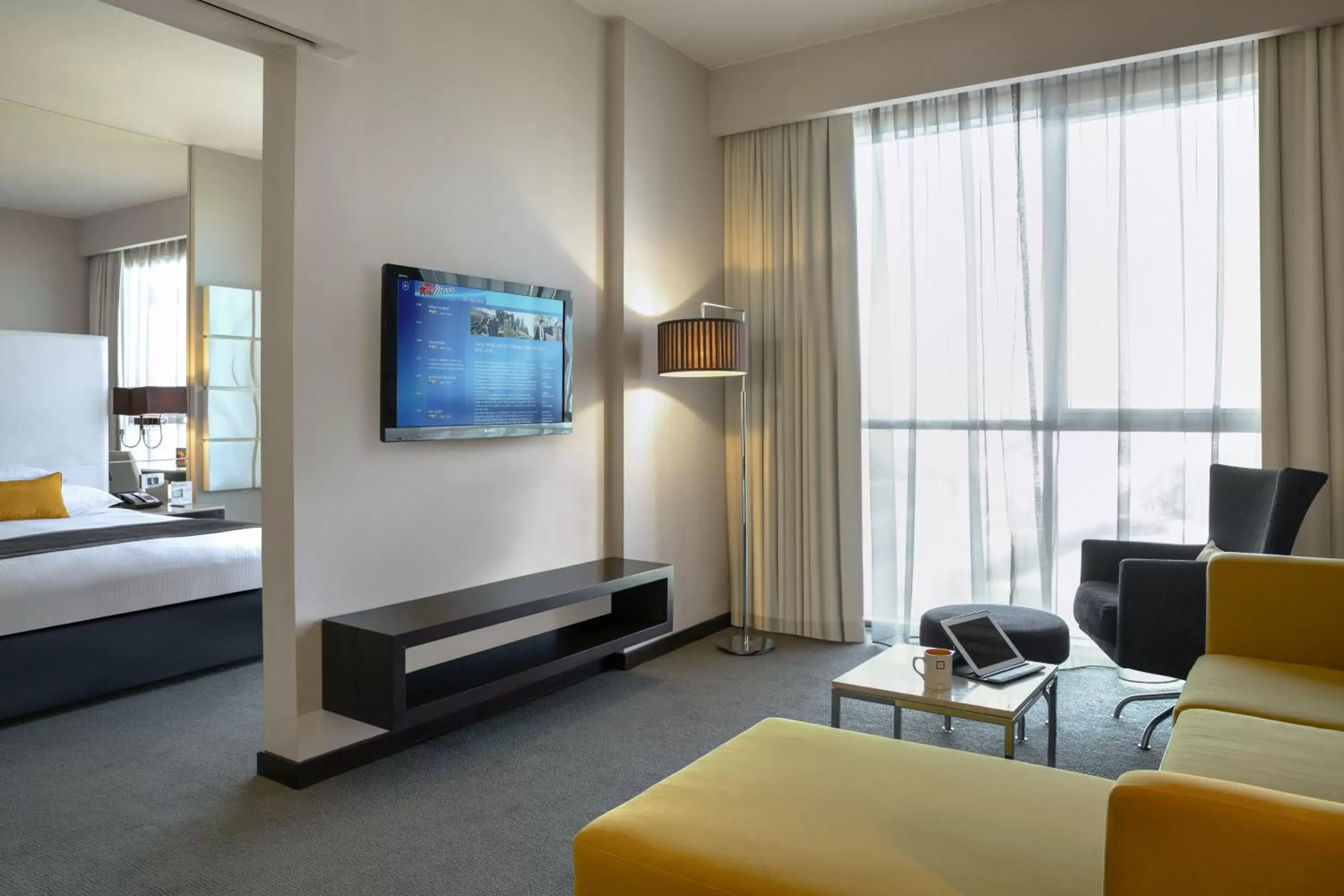 Living room, TV/Entertainment Center in Centro Sharjah - by Rotana