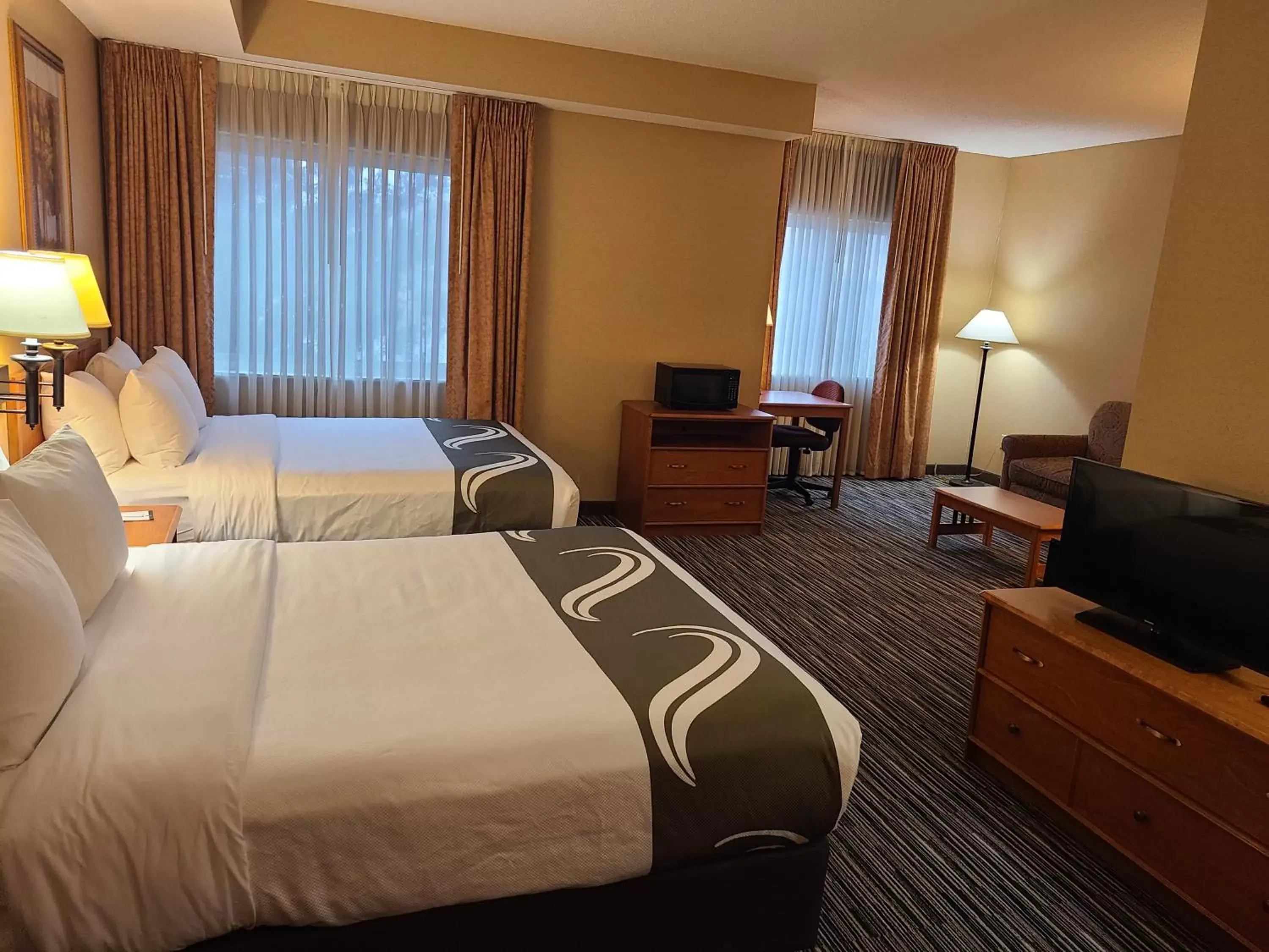 Bed in Quality Inn & Suites Wellington – Fort Collins