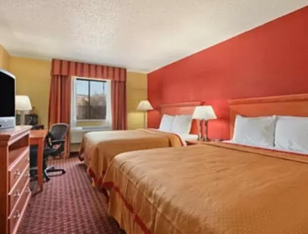 Queen Room with Two Queen Beds - Smoking in Rodeway Inn & Suites Jacksonville near Camp Lejeune