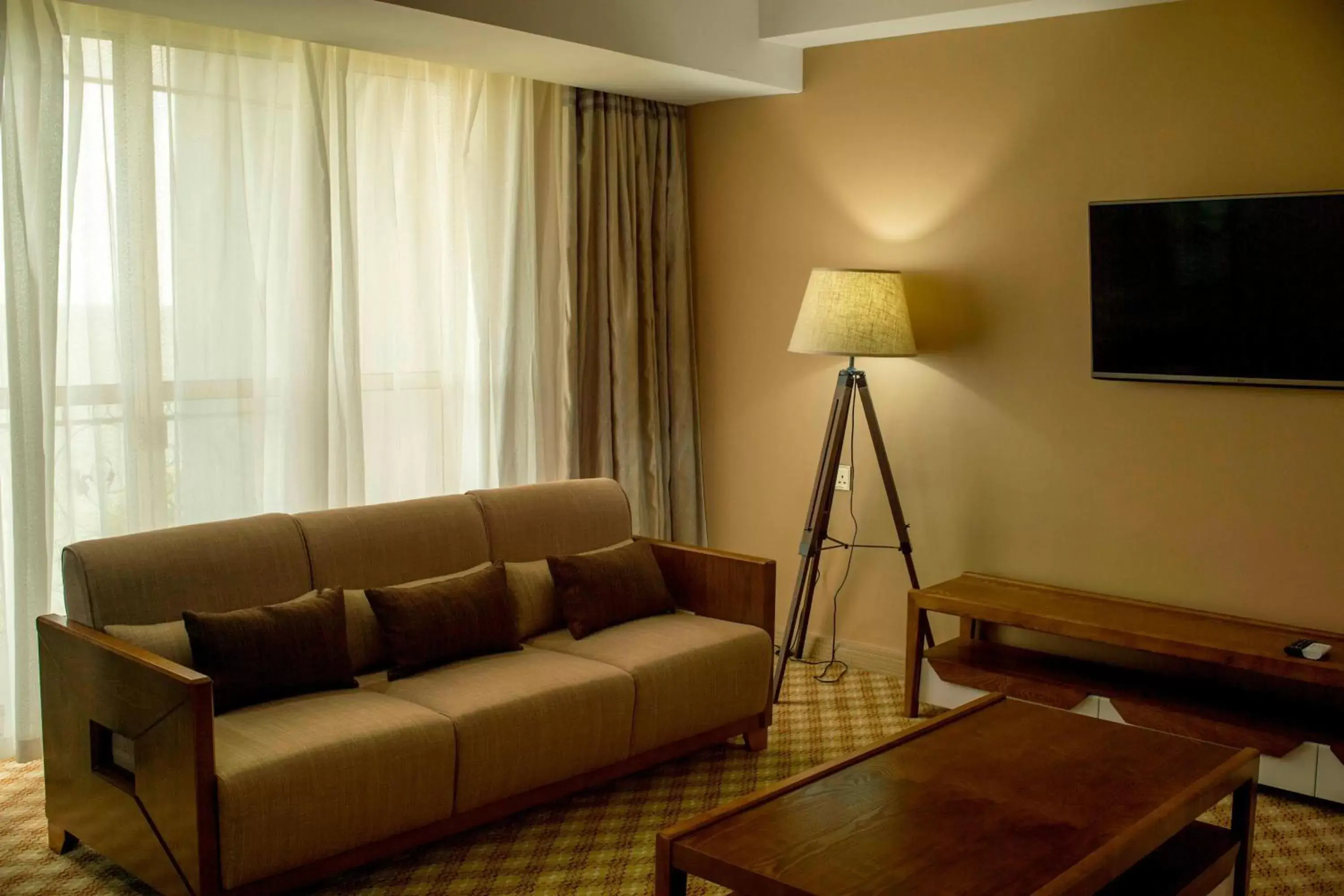 Photo of the whole room, Seating Area in Protea Hotel by Marriott Entebbe