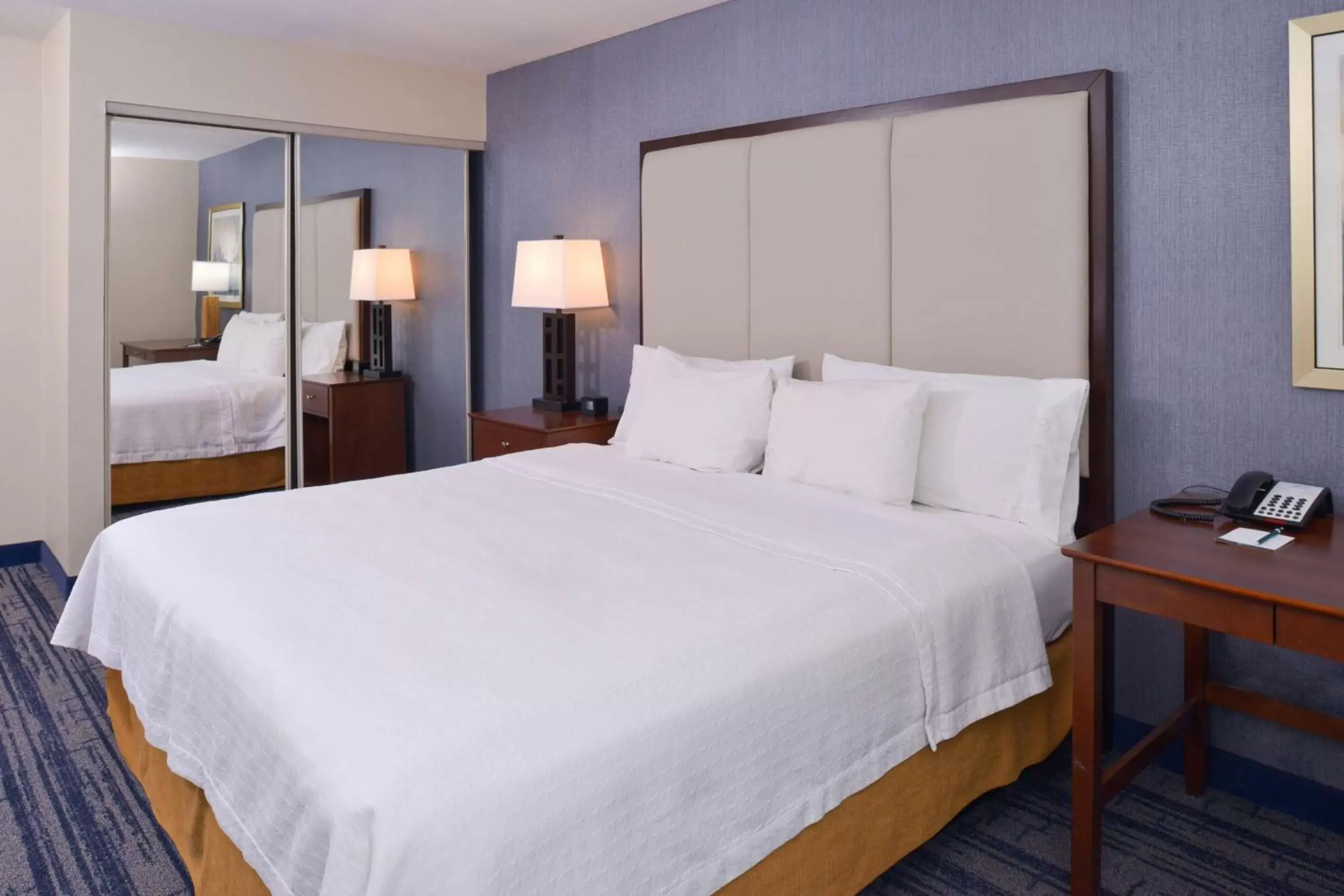 Bed in Homewood Suites by Hilton Dallas-Lewisville
