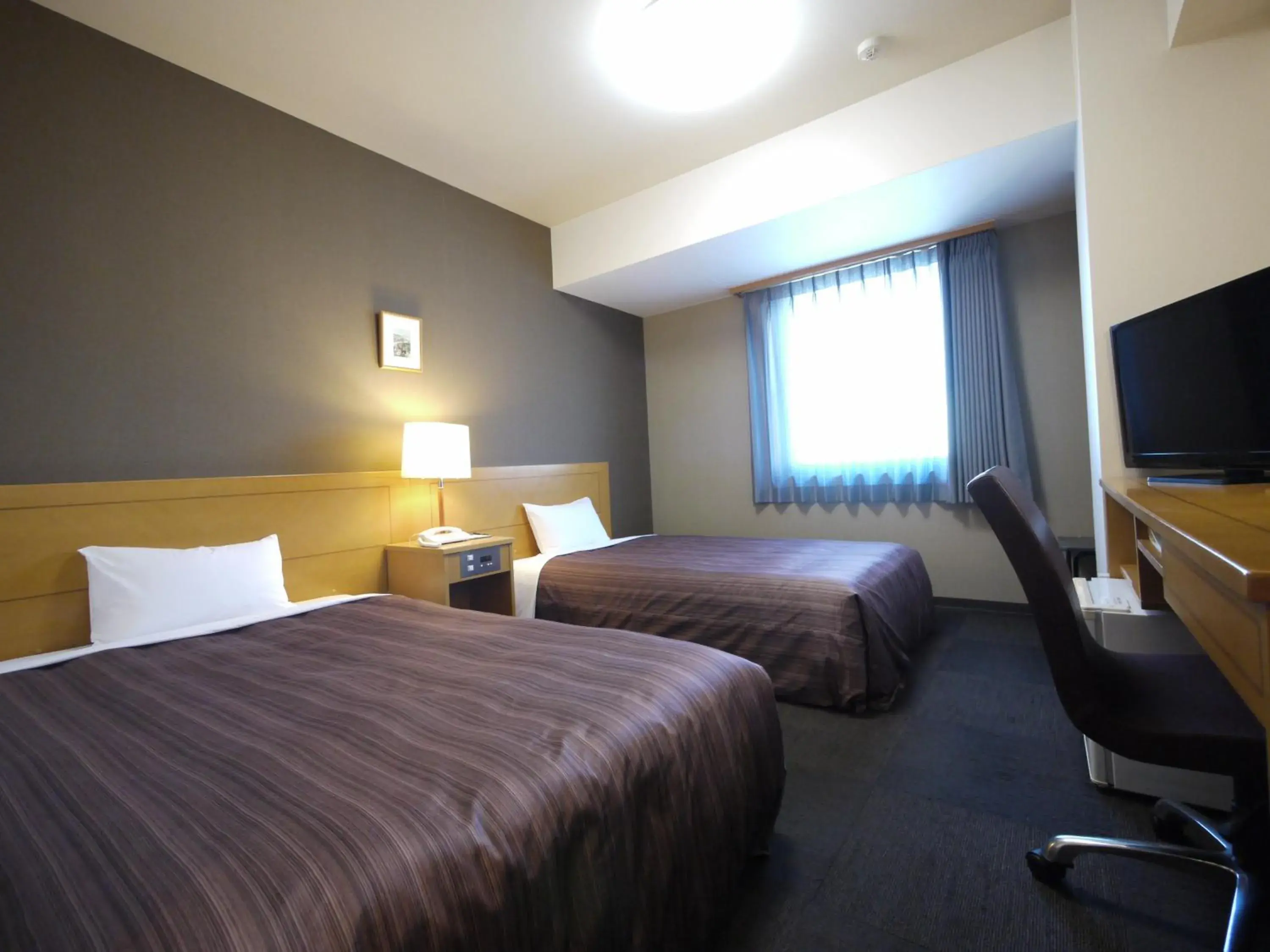 Photo of the whole room, Bed in Hotel Route Inn Obihiro Ekimae