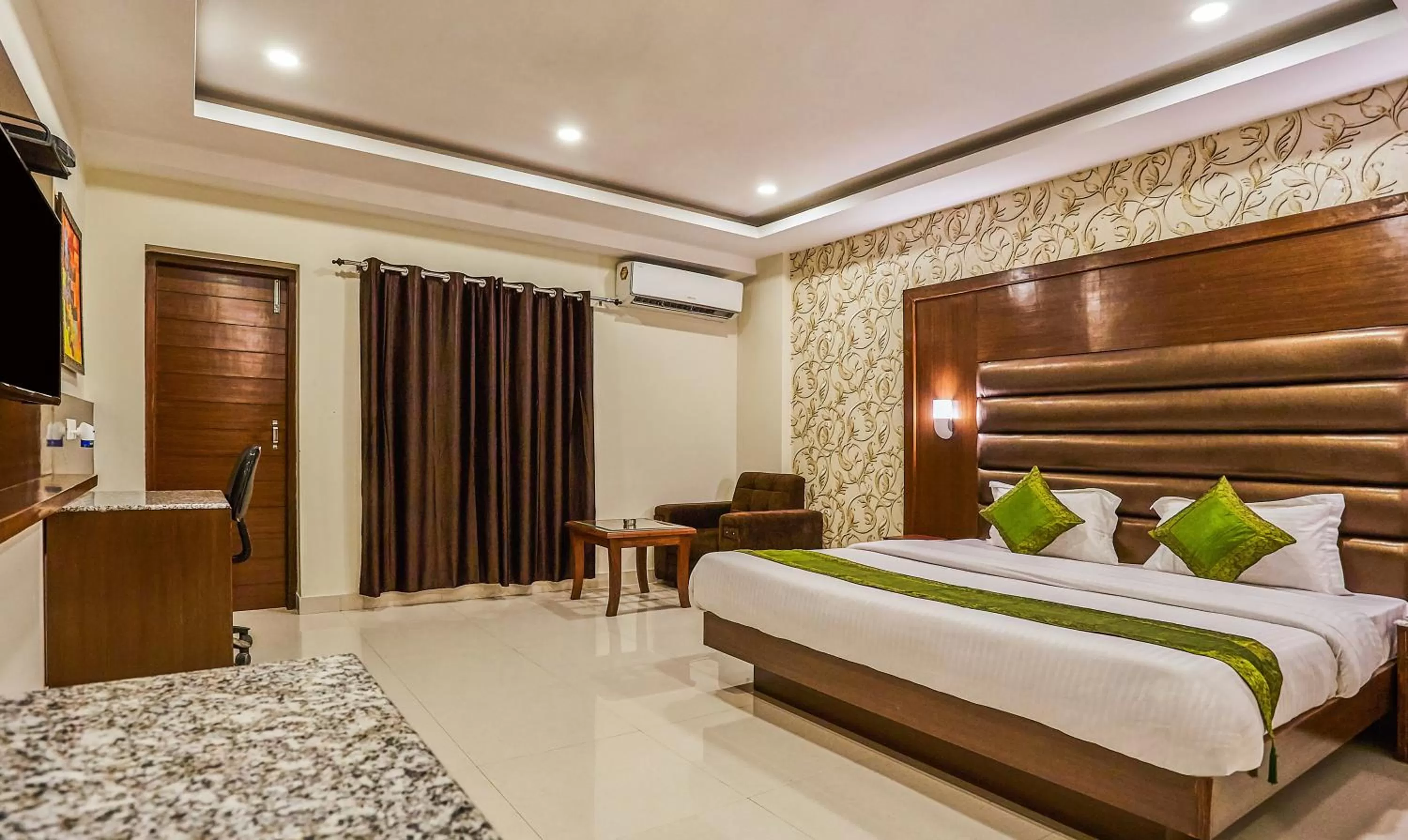 Bedroom, Bed in Treebo Grand Legacy Elite With Roof Top Cafe