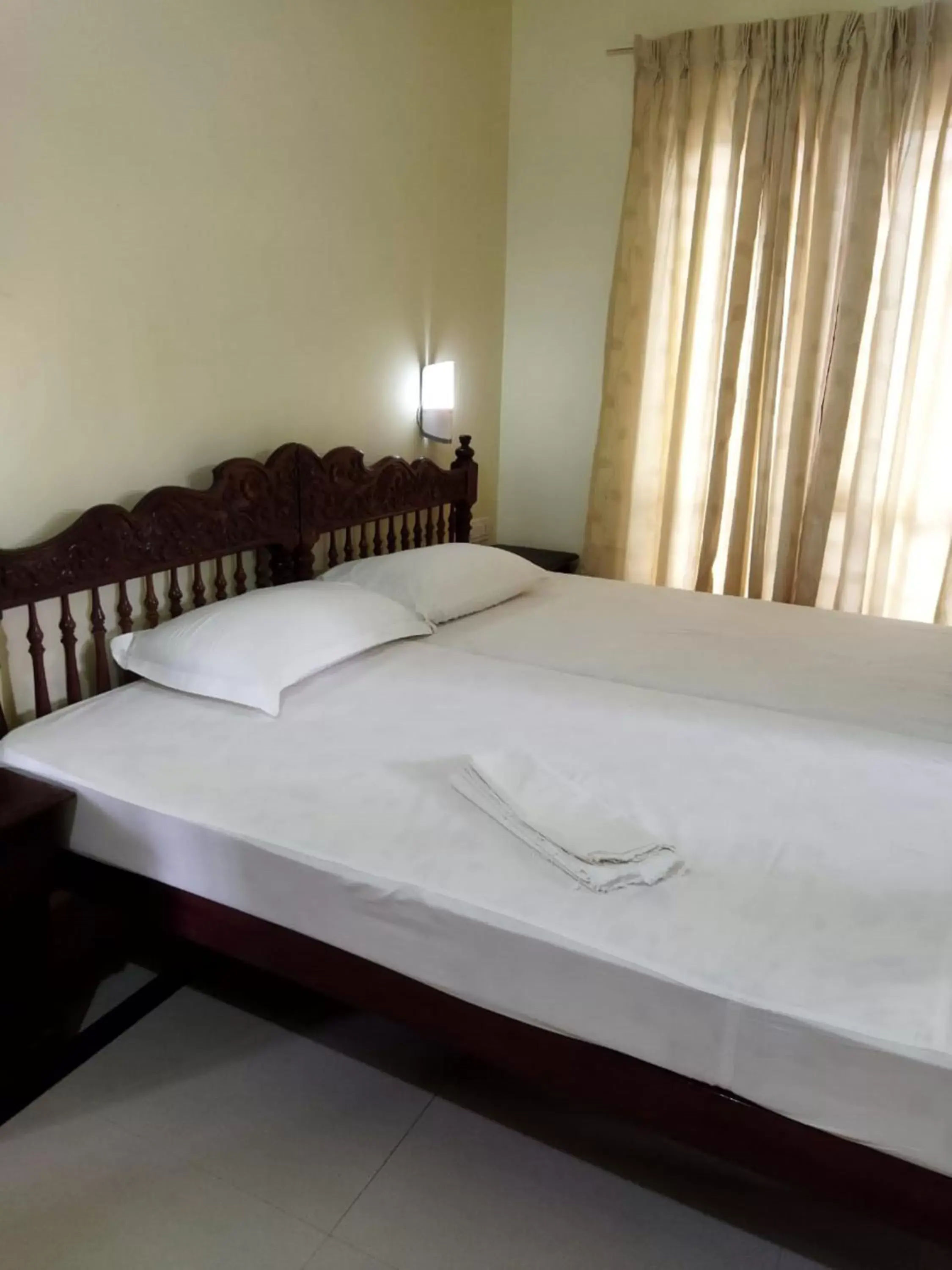 Bed in Sree Mookambika Beach Resort Bed in Sree Mookambika Beach Resort