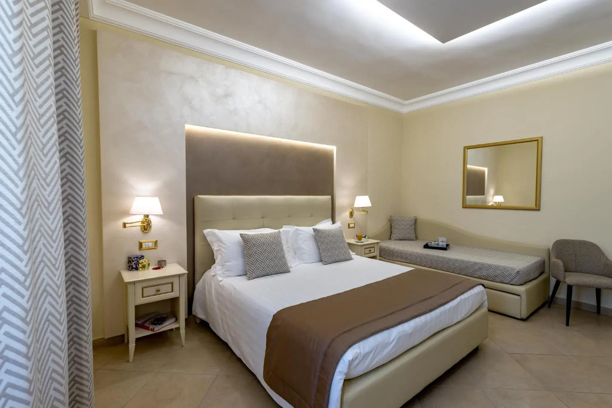Bed in Vittorio Emanuele Boutique Hotel