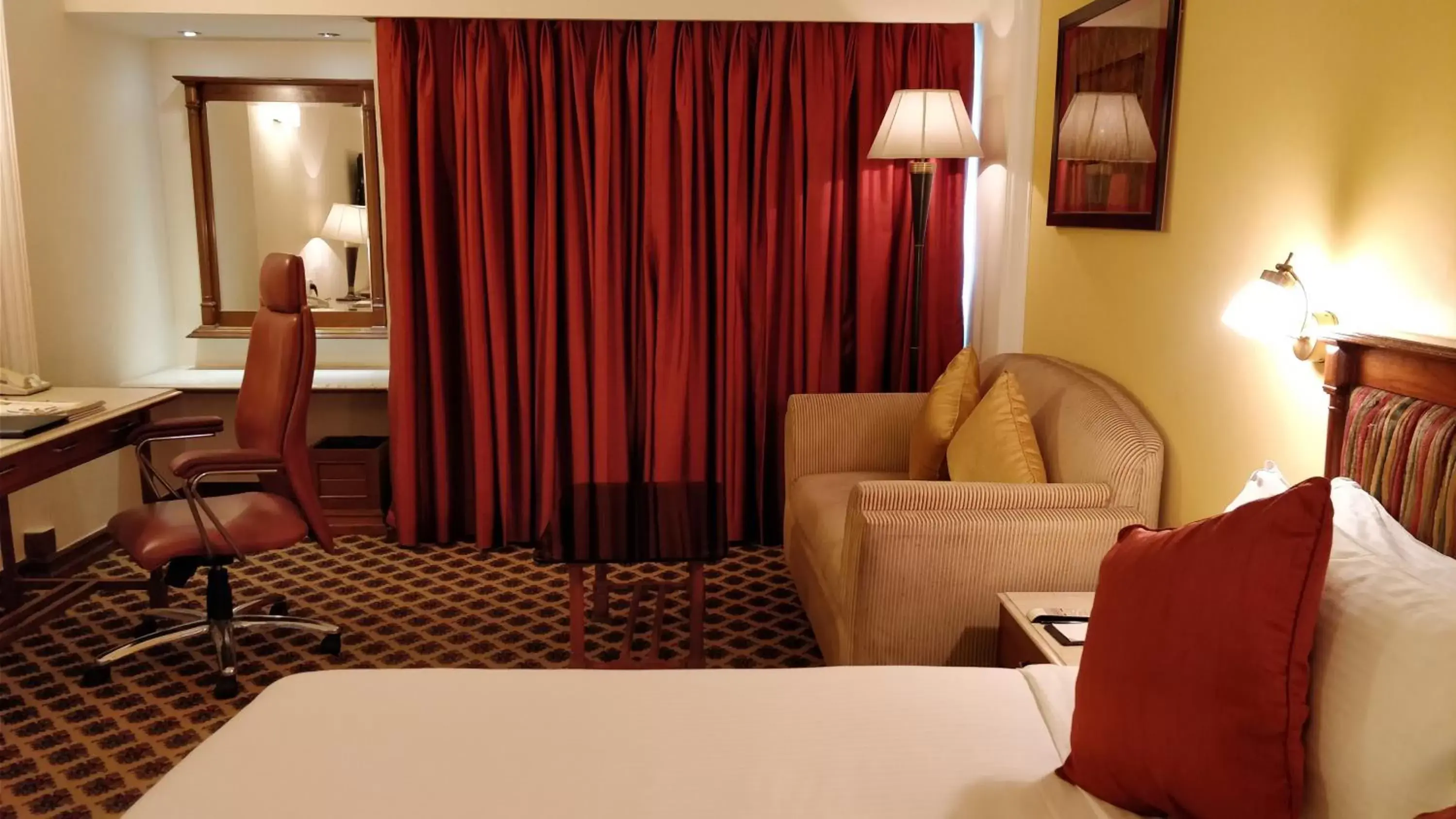 Bedroom, Seating Area in The Suryaa Hotel New Delhi