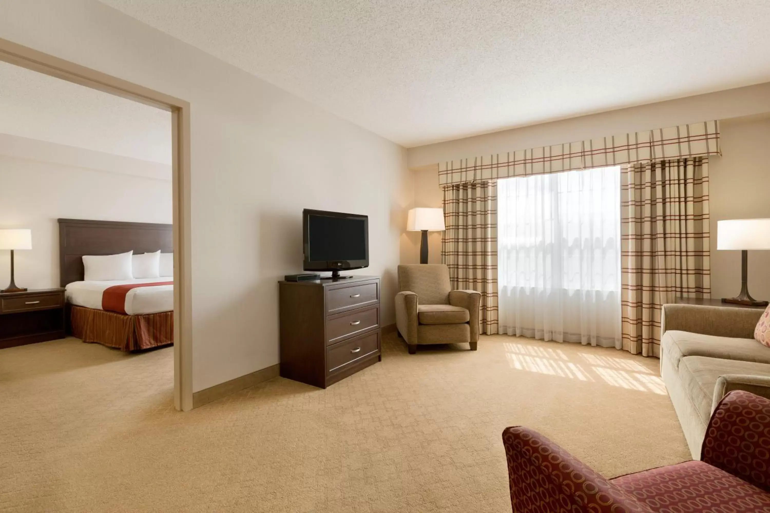 Photo of the whole room, TV/Entertainment Center in Country Inn & Suites by Radisson, Calgary-Northeast