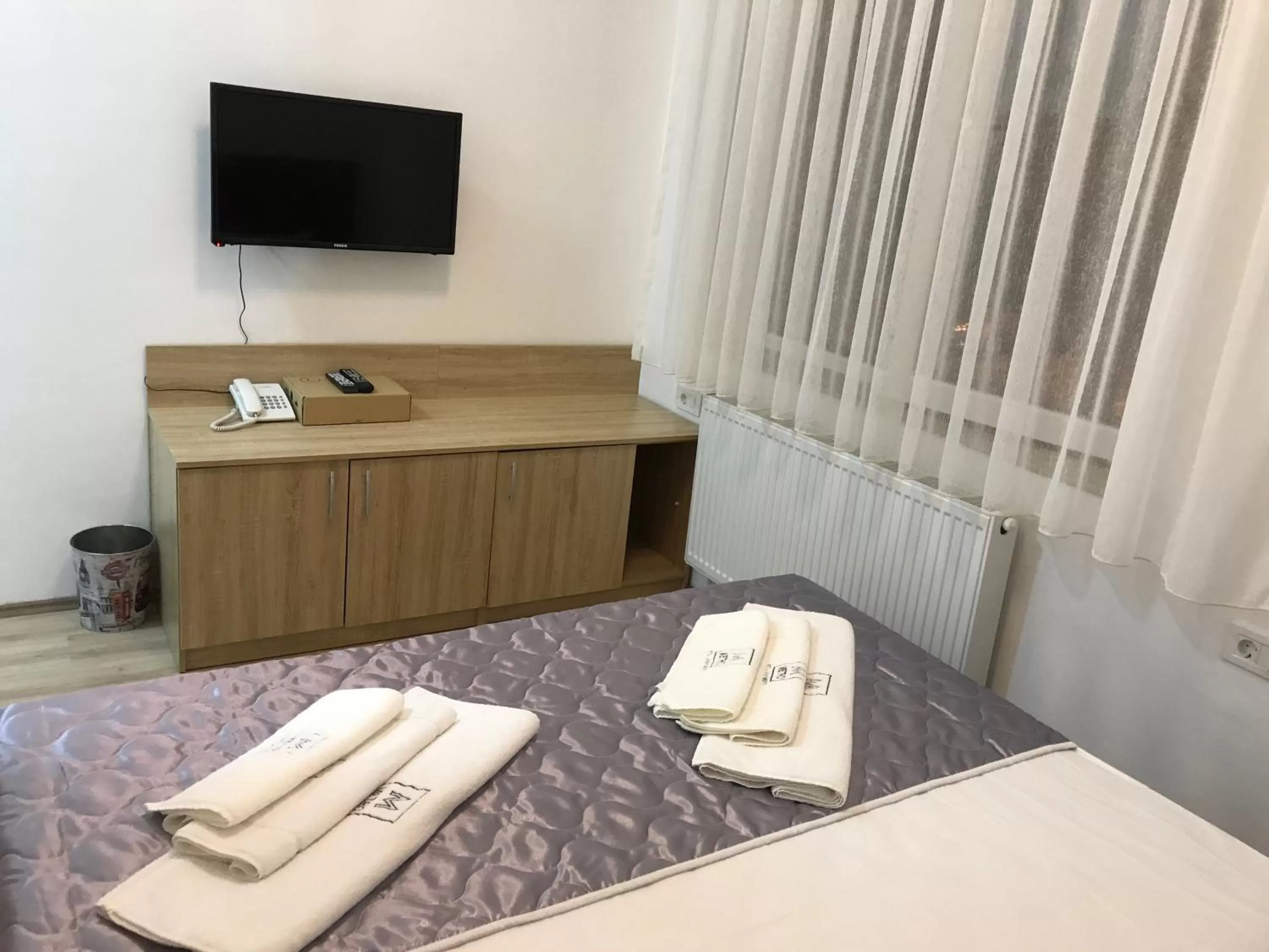 Photo of the whole room, TV/Entertainment Center in Villa Nina Hotel & Lounge bar