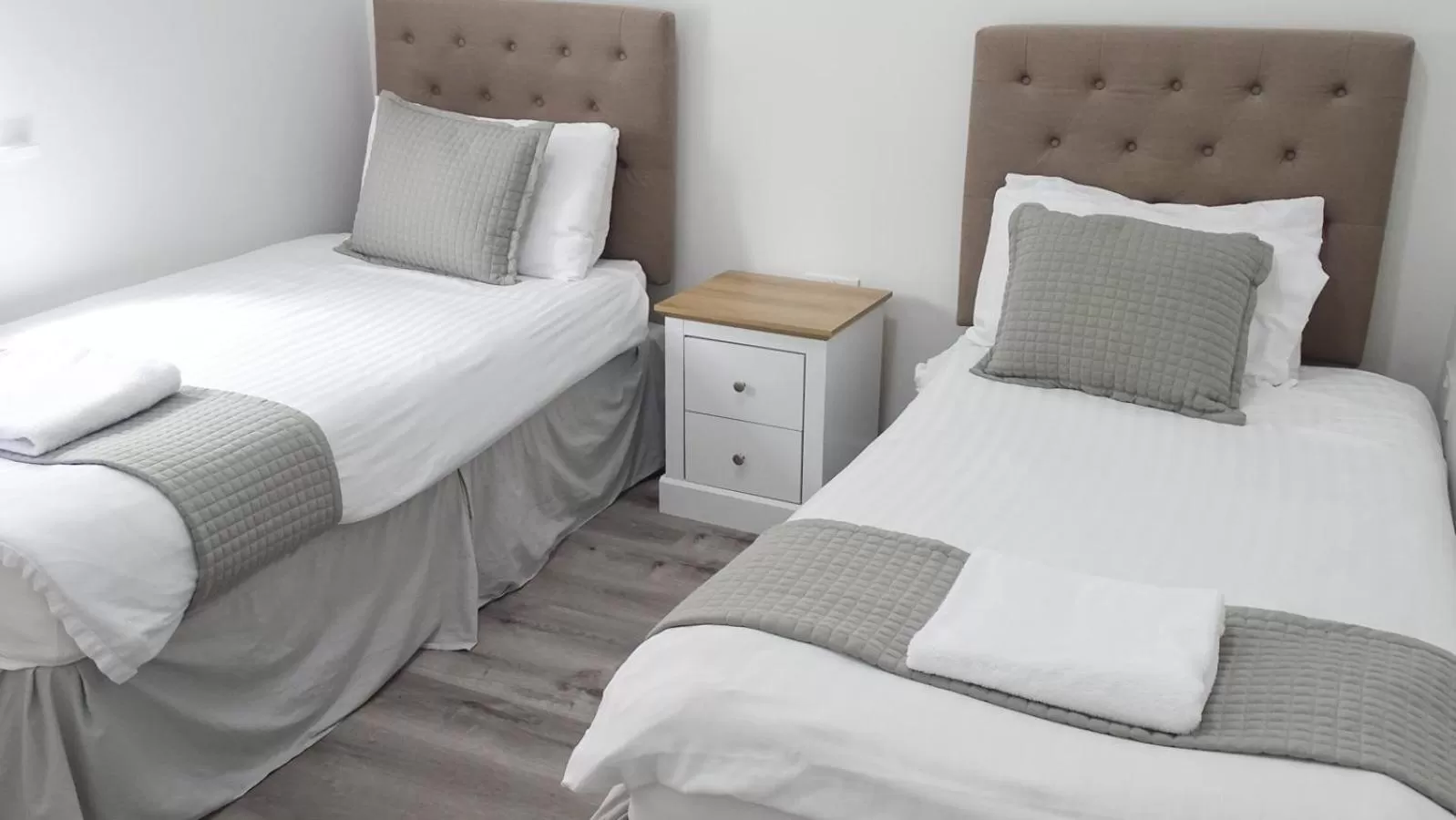 Bed in Cocoon @ International Inn + Apartments