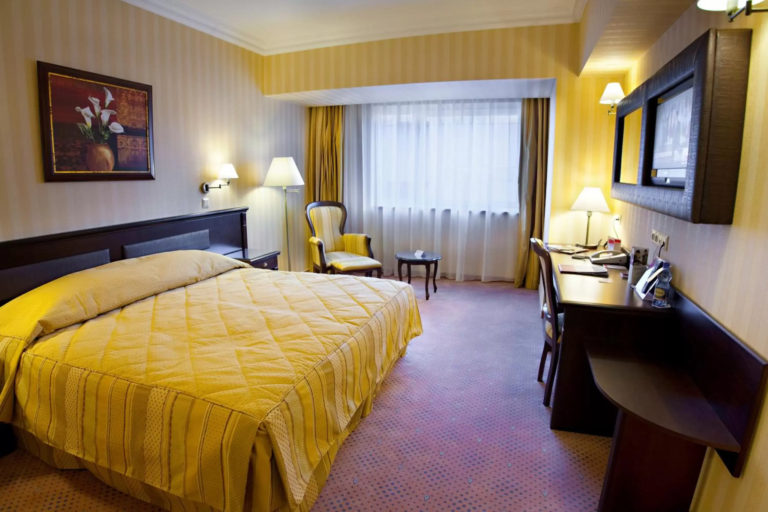 Bed in Ramada Hotel & Suites by Wyndham Bucharest North