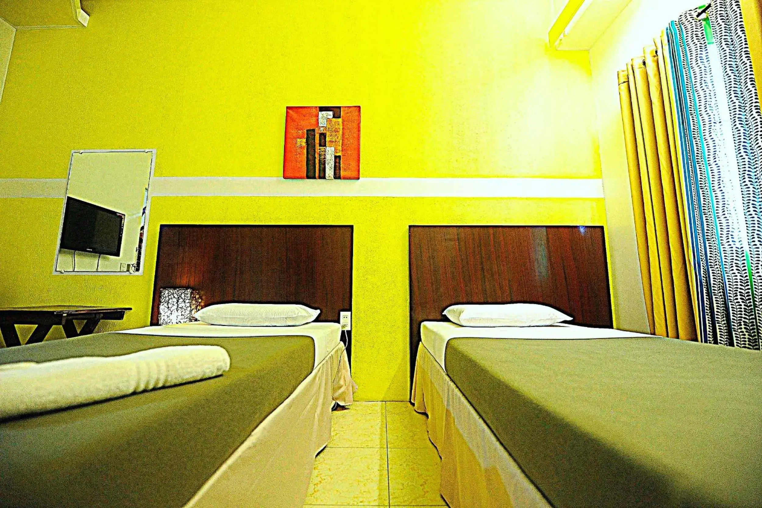 Bed in First Pacific Inn Davao