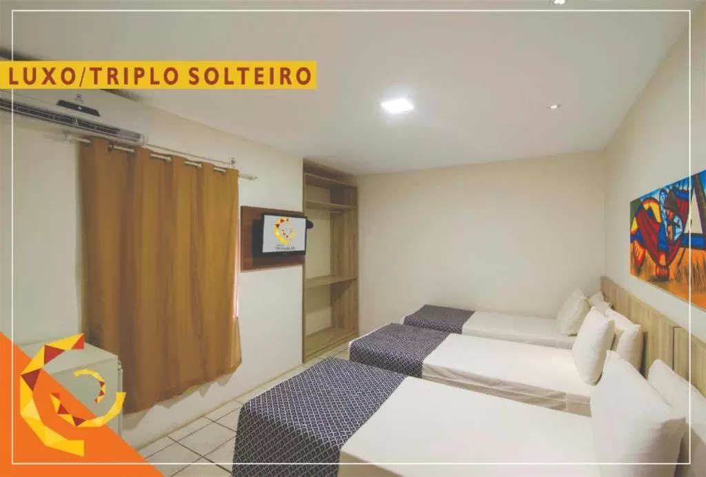 Bed in Netuanah Praia Hotel