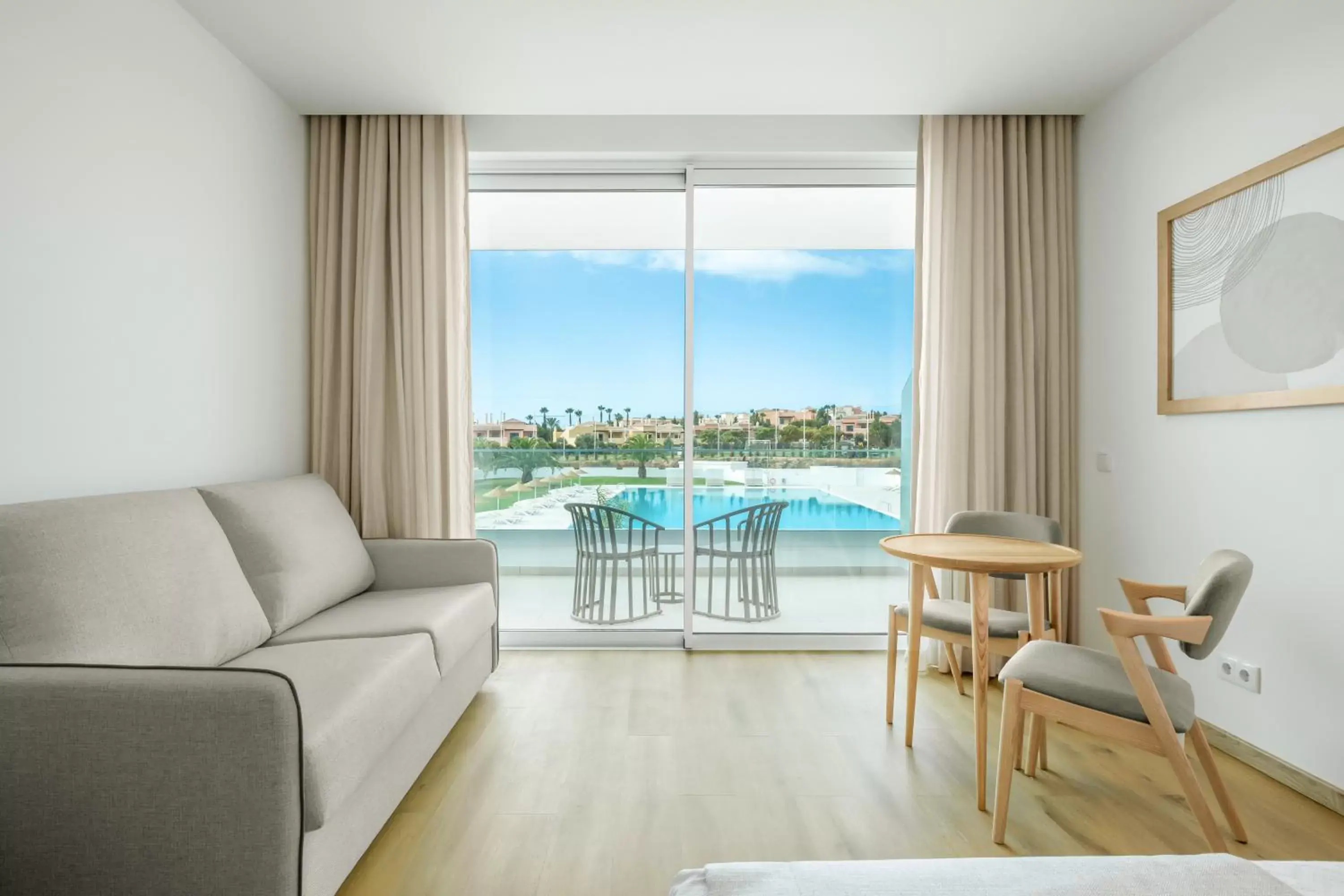 Living room, Pool View in Ancora Park - Sunplace Hotels & Resorts