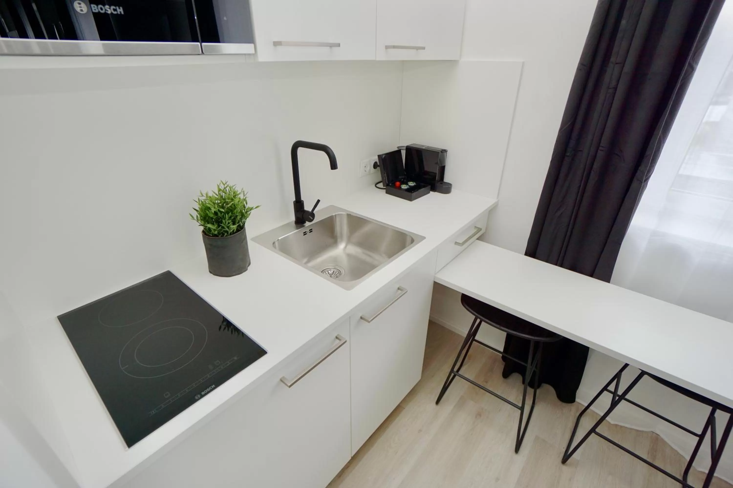 Kitchen or kitchenette in Motel by Maier Götzis- kontaktloser Check-in